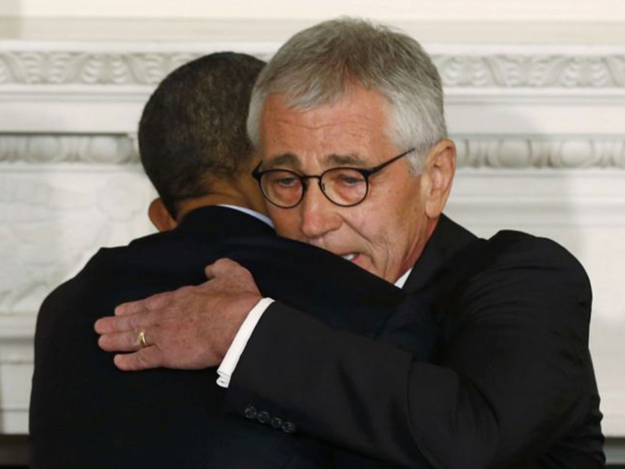 Obama embraces Hagel after announcing his resignation