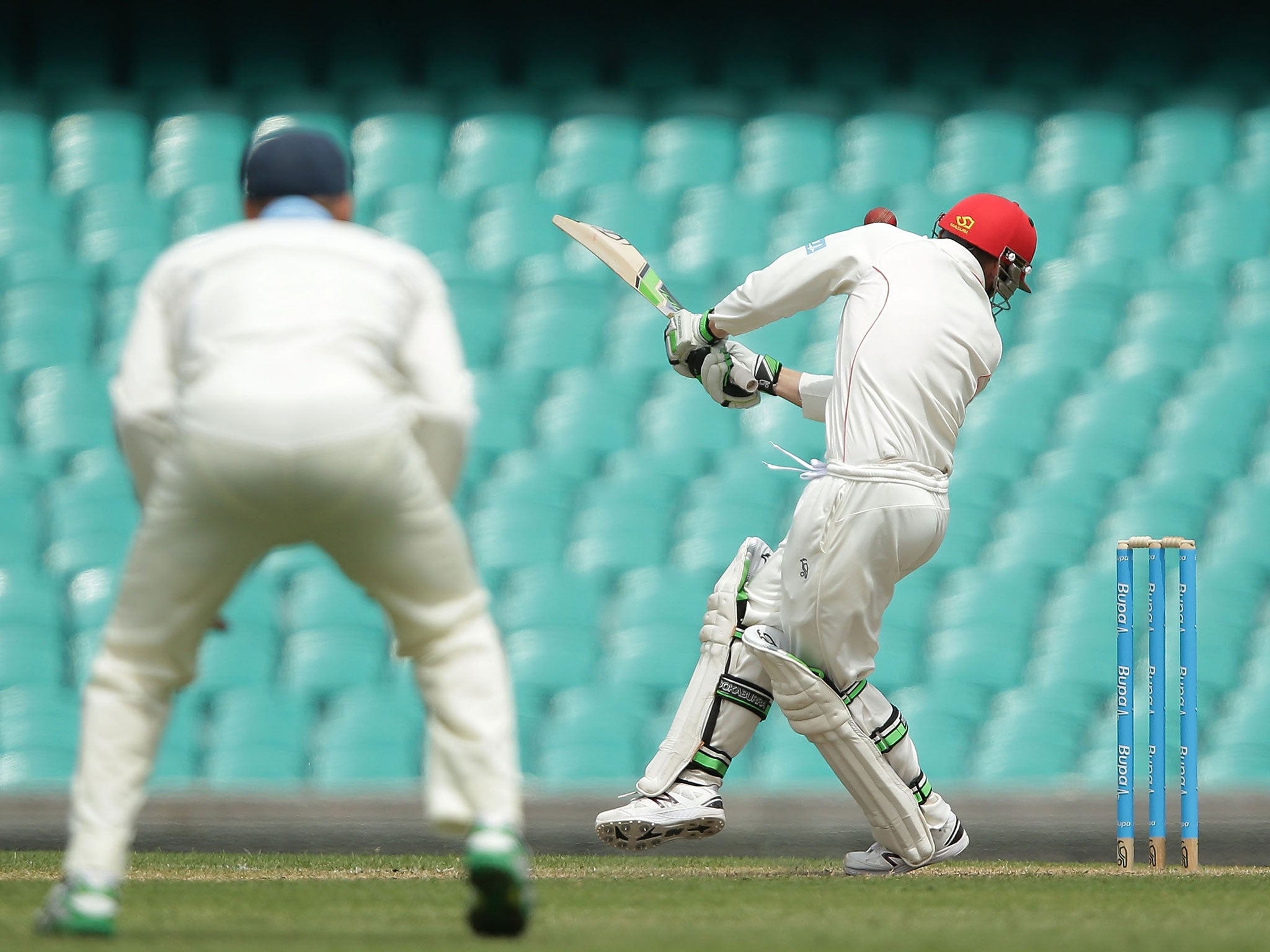 Hughes is hit by a bouncer from Sean Abbott