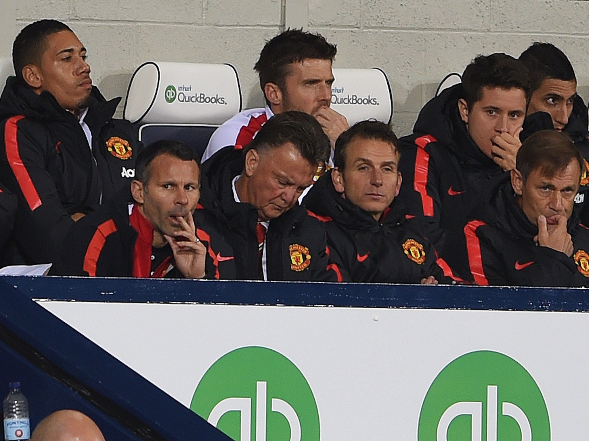 Giggs sits alongside United manager Van Gaal