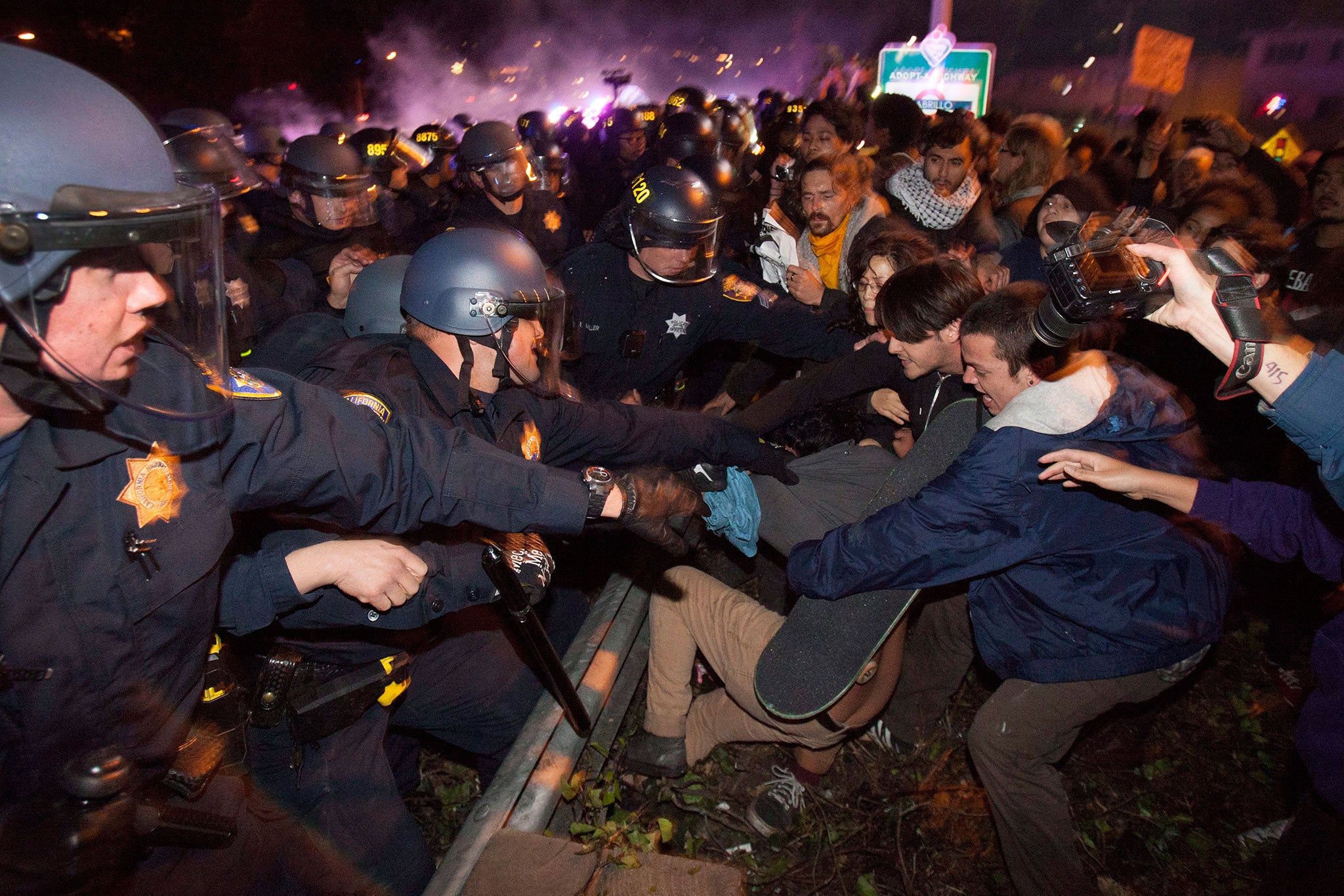 California Highway Patrol officers clash with protesters