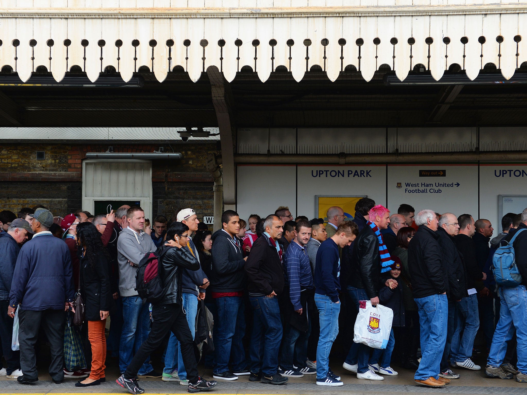 Fans arrive at Upton Park tube station.