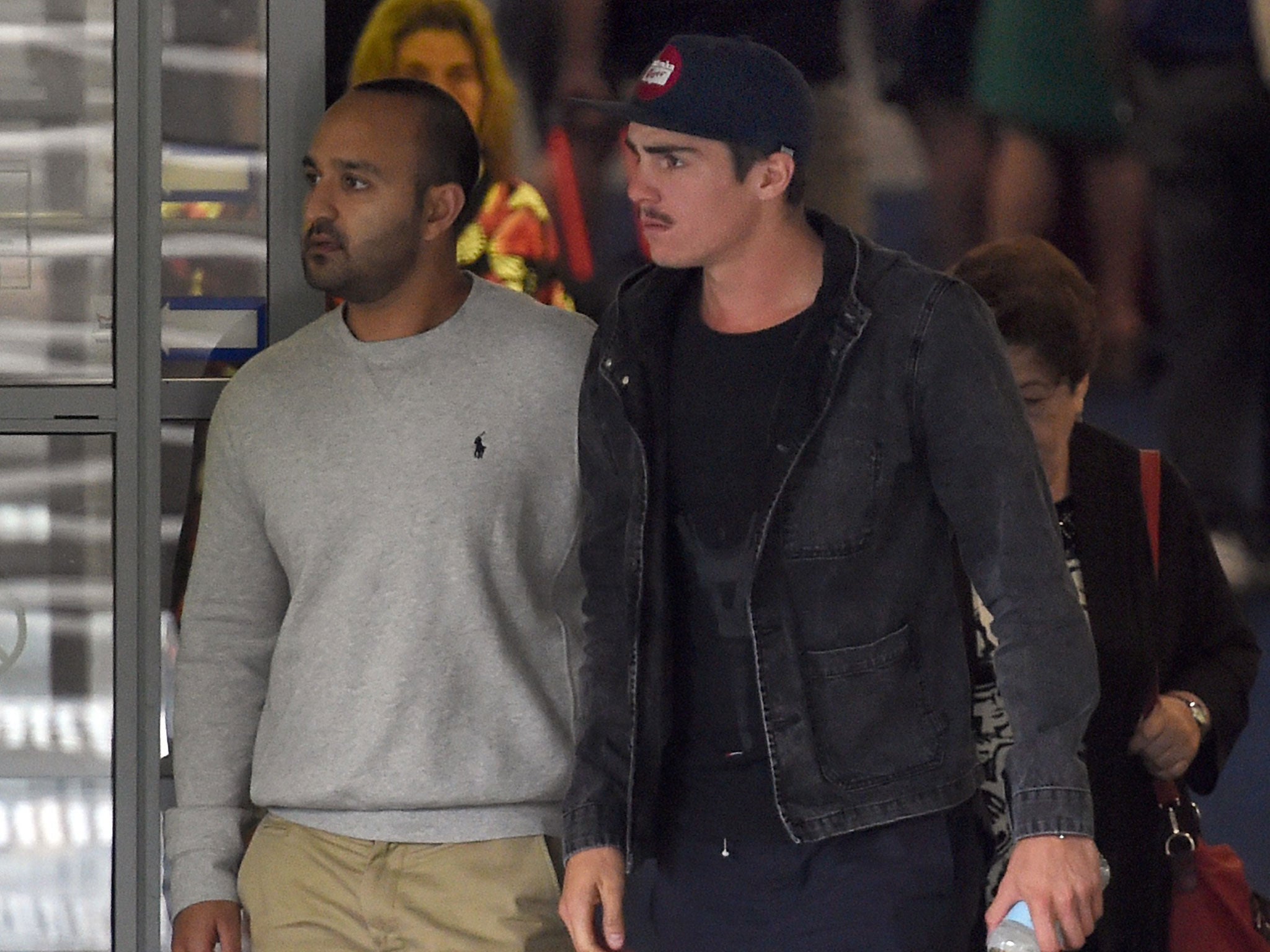 Australian bowler Sean Abbott (right) leaves St Vincent's Hospital following the death of fellow Australian batsman Phillips Hughes in Sydney on November 27, 2014