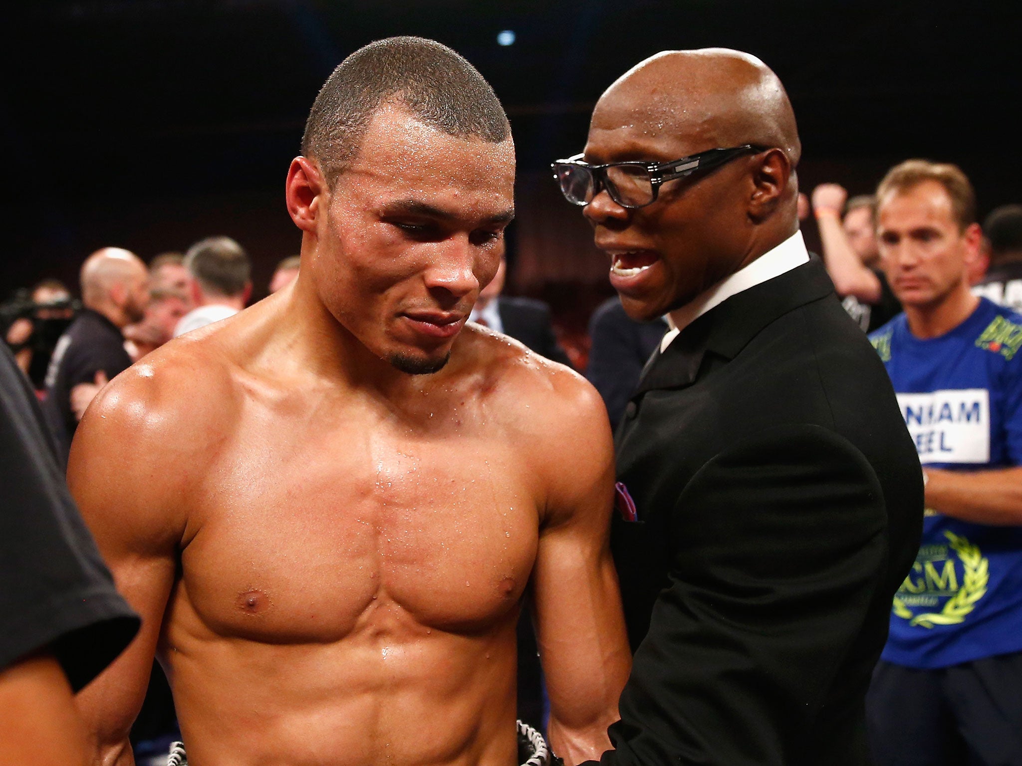 Chris Eubank Jr speaks with his father, Chris, after losing by a split decision to Billy Joe Saunders