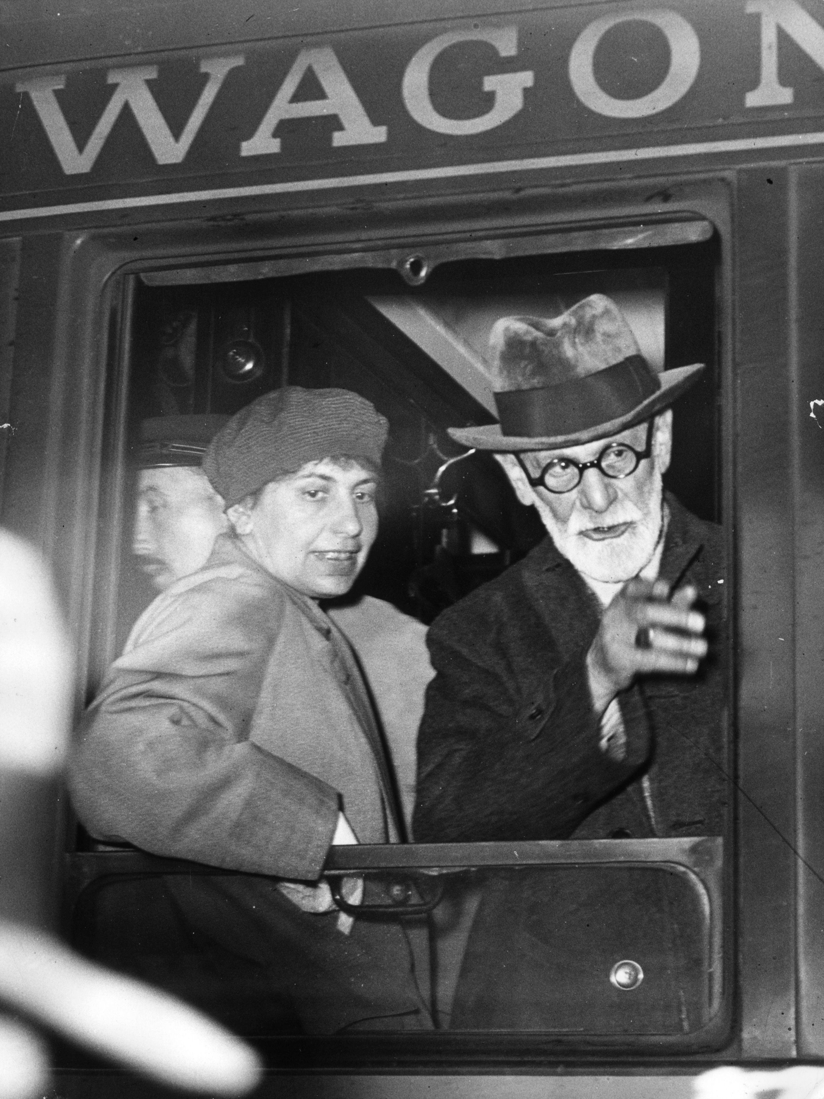 Anna Freud with her father Sigmund Freud at the window of a wagon-lit on arrival at the Gare de l'Est, Paris.