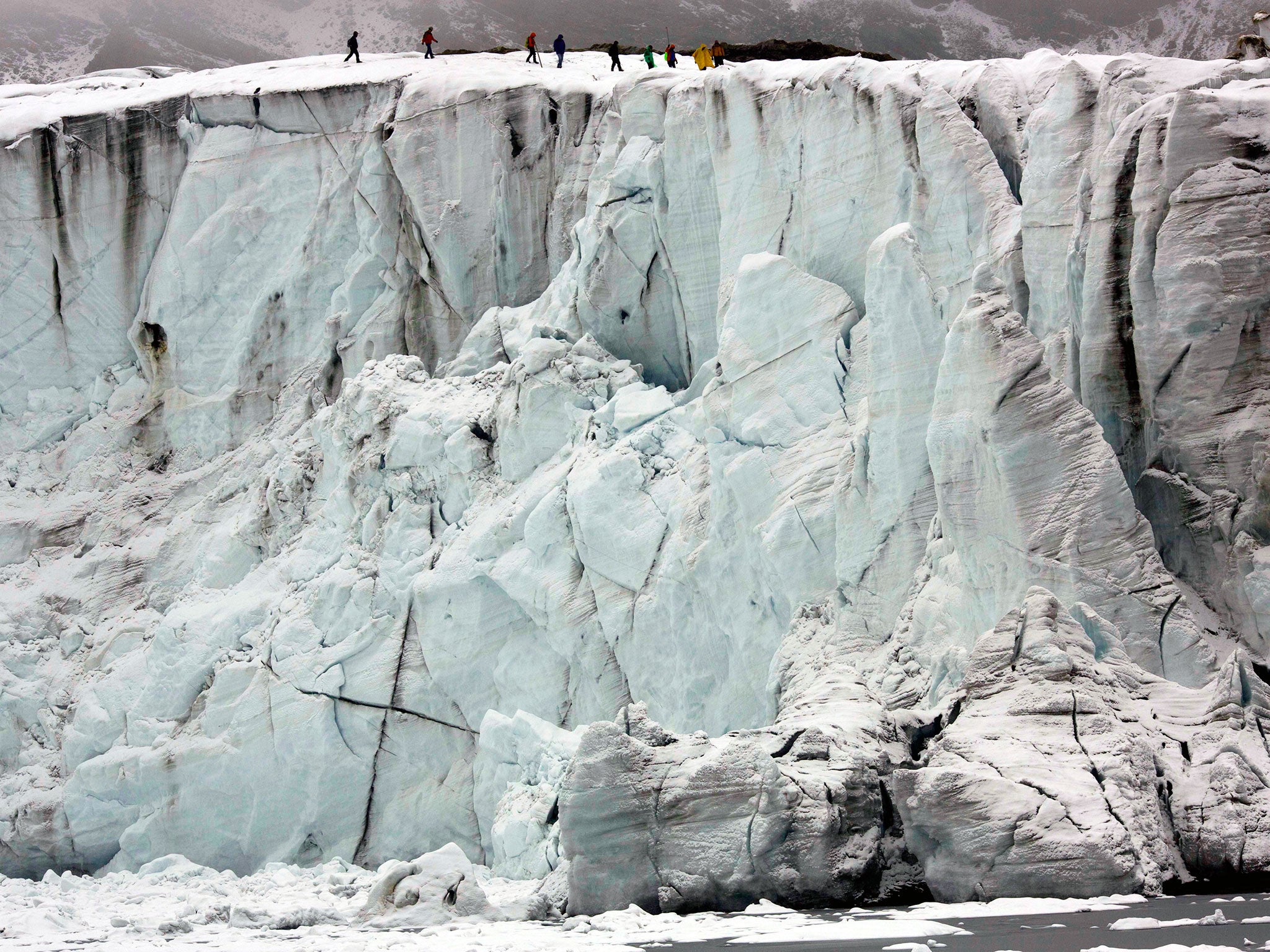 Members of the glaciology unit of the Peruvian national water authority walk on Pastoruri glacier in Huaraz, Peru. According to Alejo Cochachin, coordinator of the glaciology unit, The Pastoruri glacier retreated 576 meters between 1980 and 2014. Peru's g