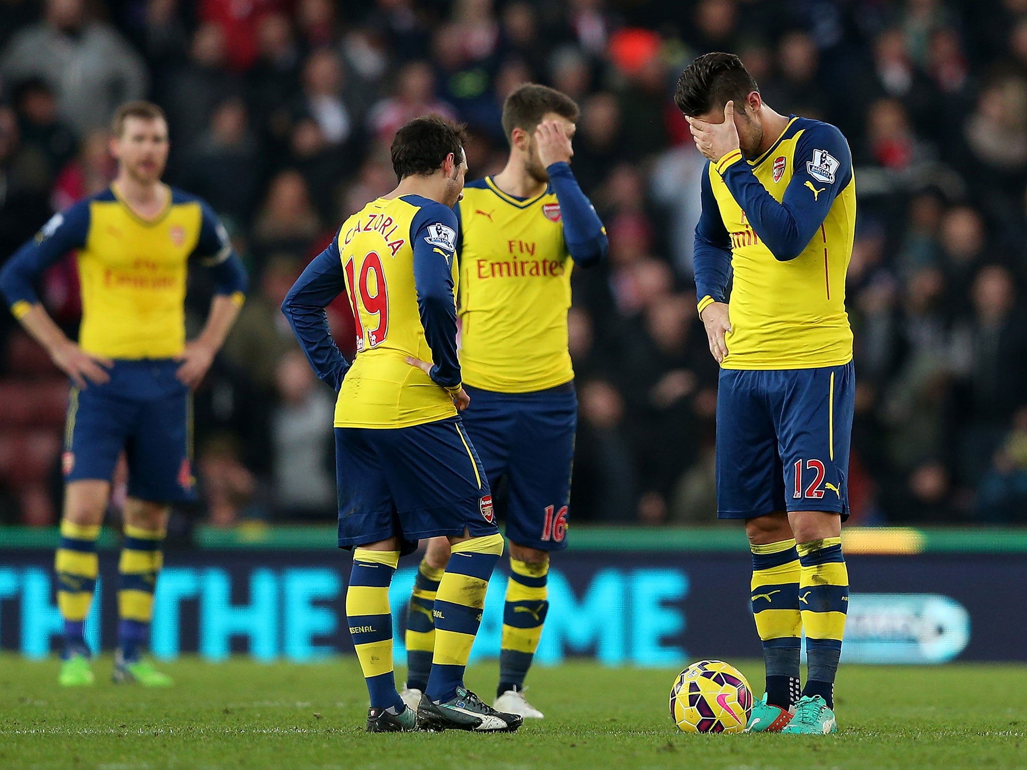 Cazorla, Ramsey and Giroud look disconsolate after conceding a third goal