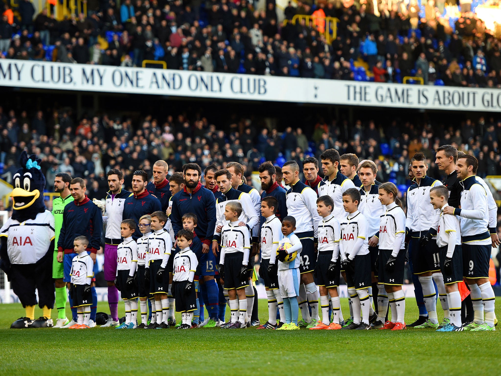 Players from both teams line-up before kick-off to remember the Christmas tribute from the First World War 100 years ago