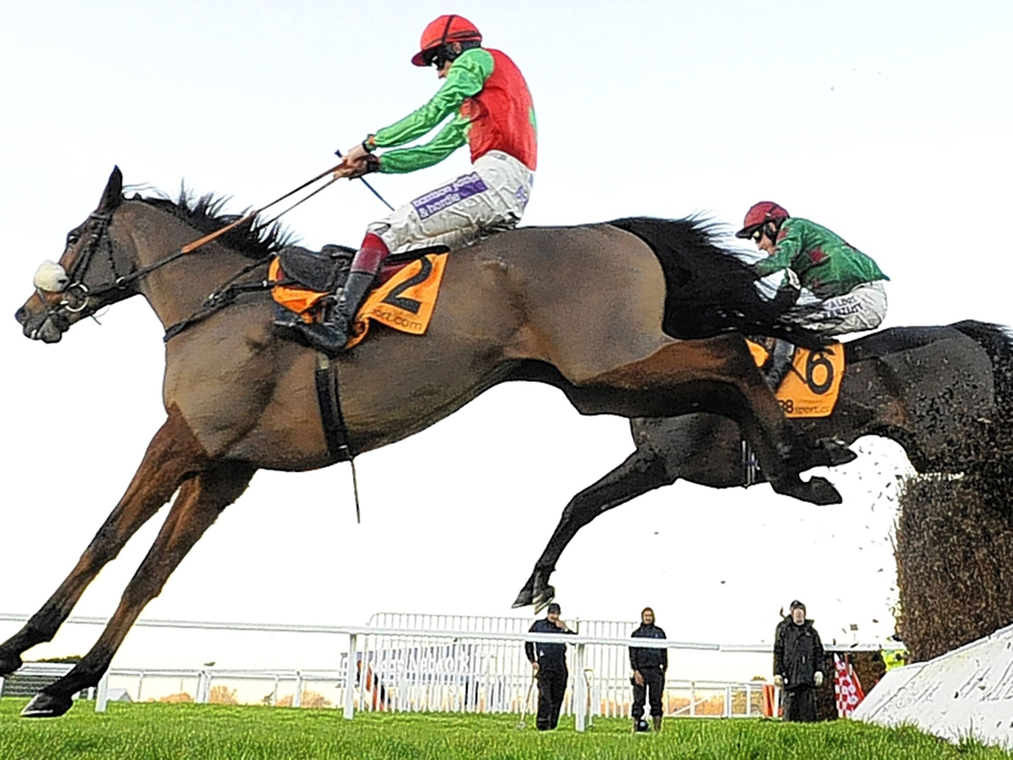 Clear winner: Dodging Bullets jumps the last ahead of Somersby on the way to victory at Sandown