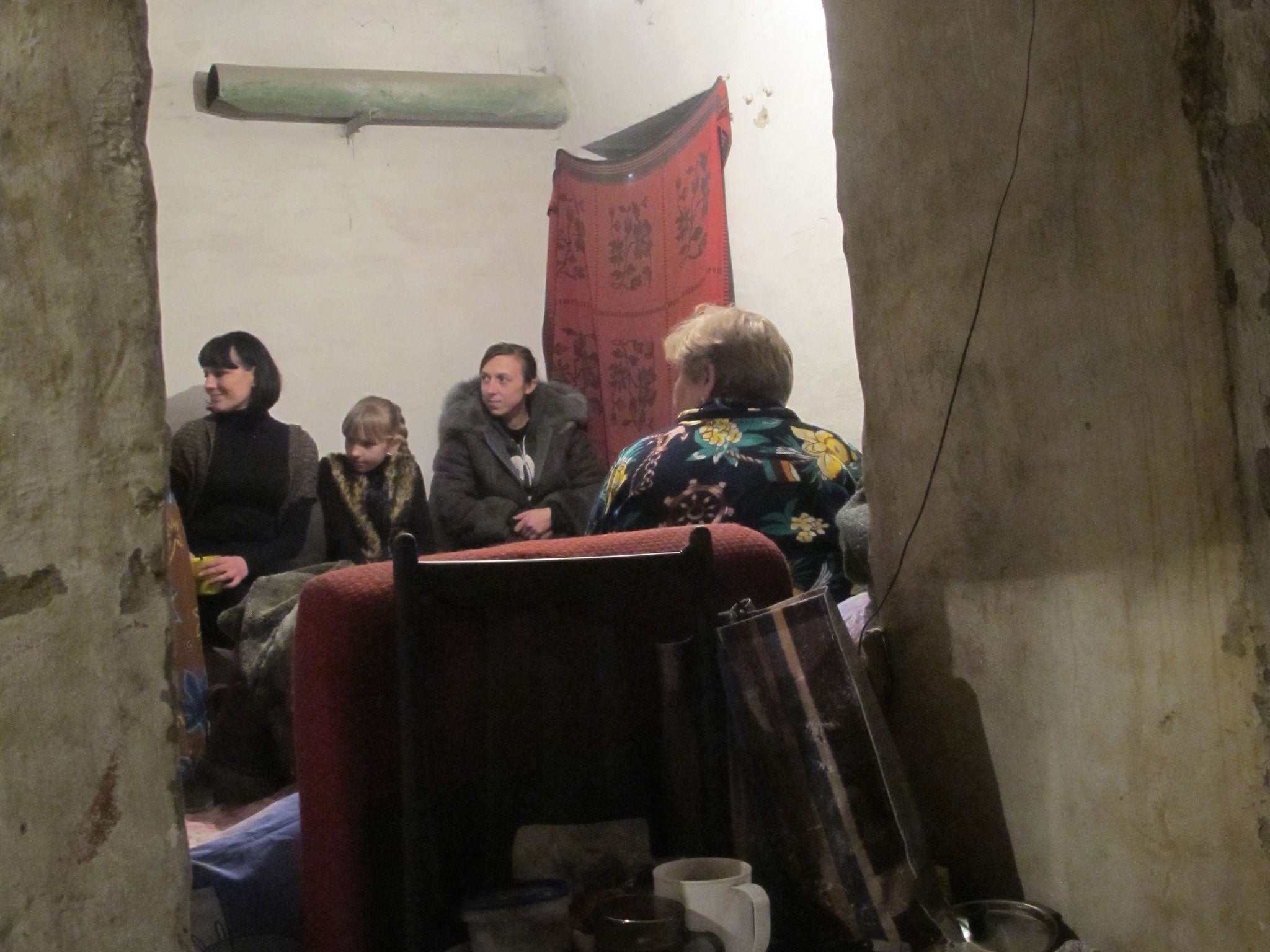 One of many families living in the cramped shelters under Kosareva Street, west Donetsk