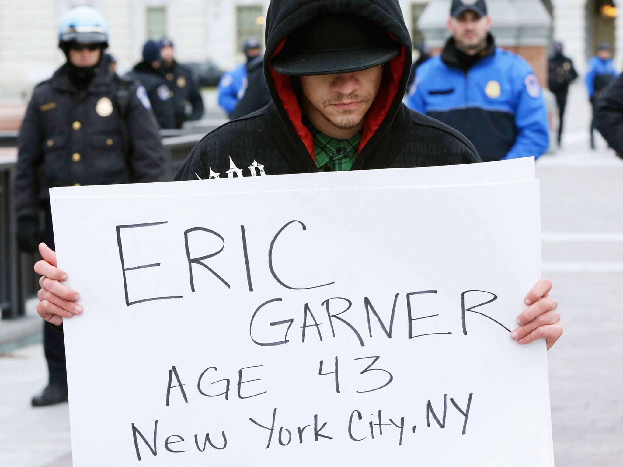 A protester with the Anti-Lynching Movement participates in a die-in demonstration at the U.S. Capitol to protest against a grand jury's decision to not indict a police officer for the death of Eric Garner