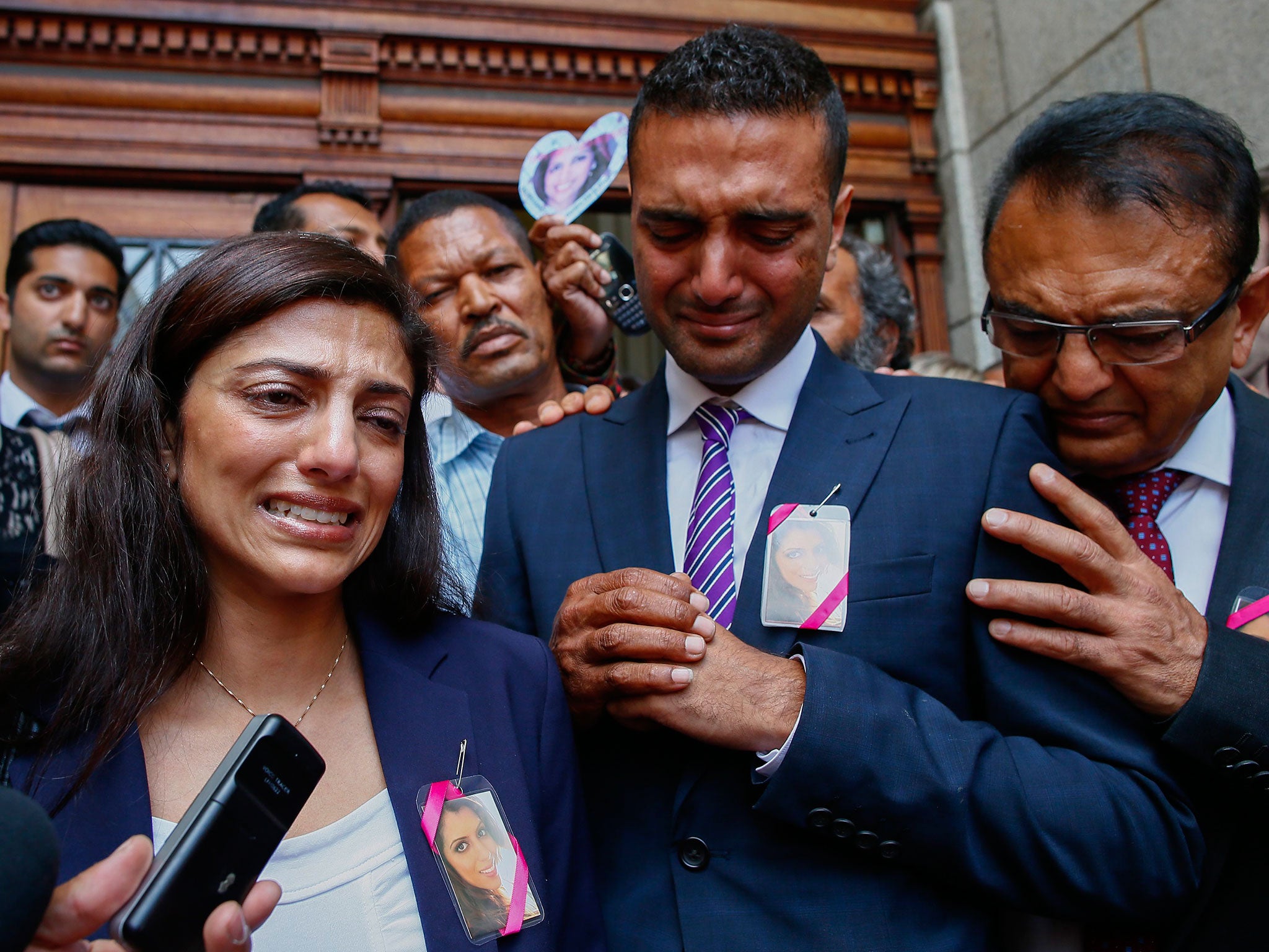 Ami Denborg, Anni’s sister, accompanied by her brother and father, outside Western Cape High Court