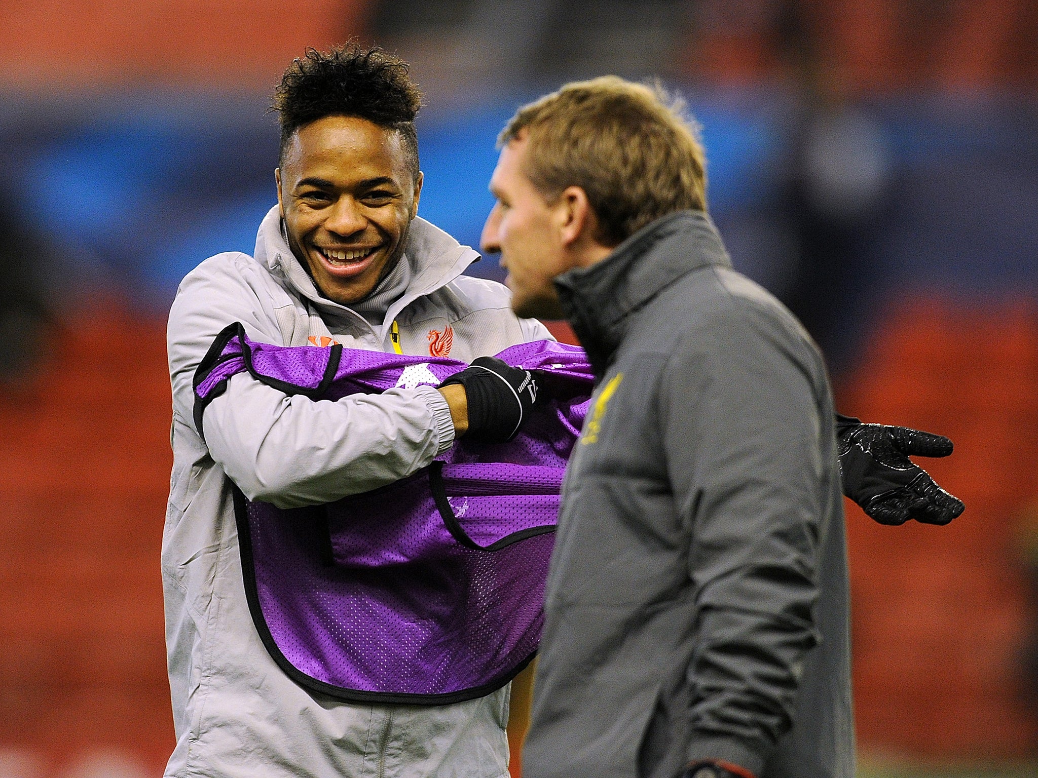 Liverpool forward Raheem Sterling with Brendan Rodgers