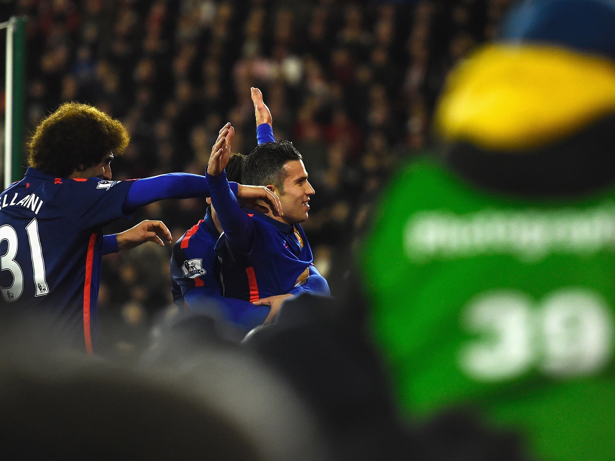 Robin van Persie celebrates his second goal