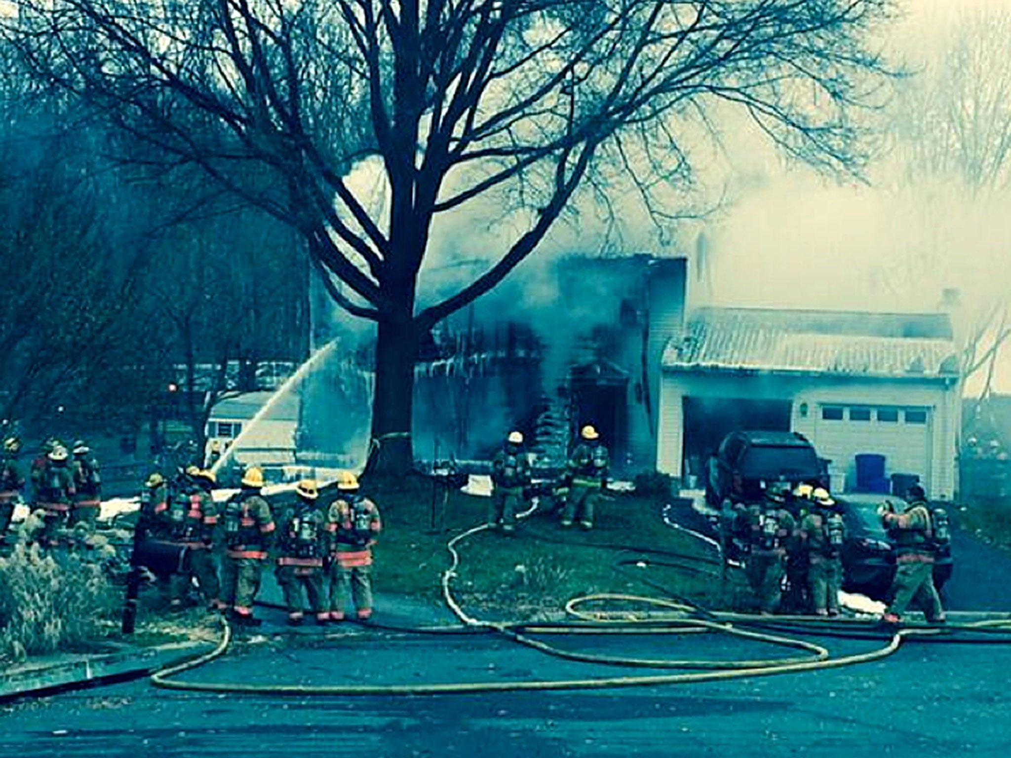 Emergency workers attend to the immediate aftermath of the crash