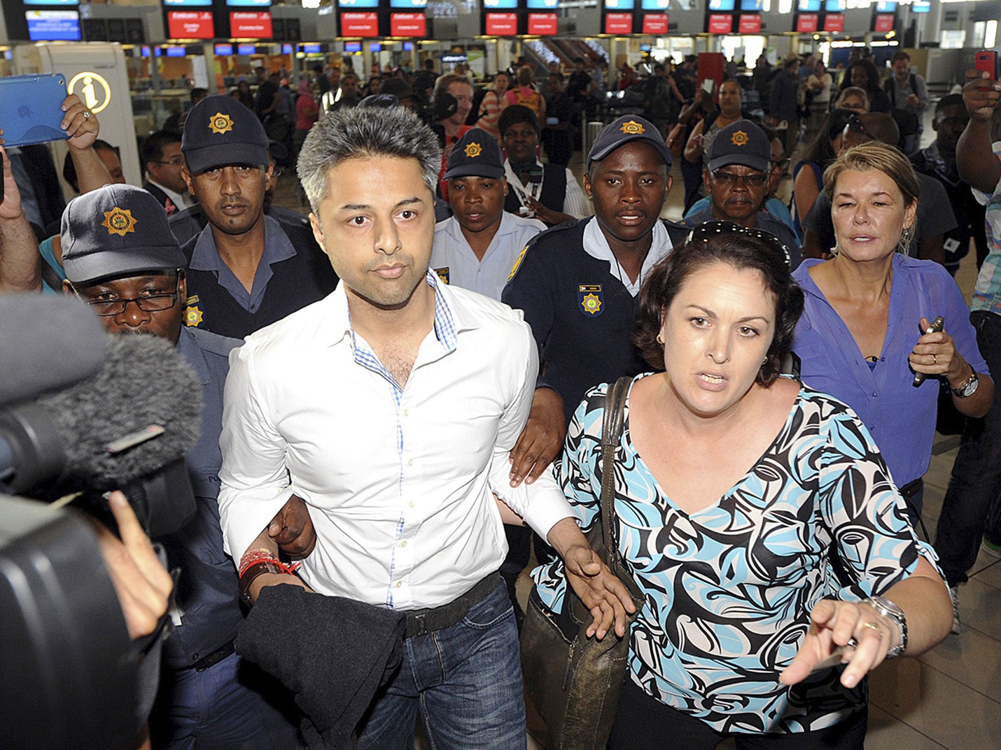 Shrien Dewani arrives at Cape Town International Airport as he prepares to fly out of South Africa