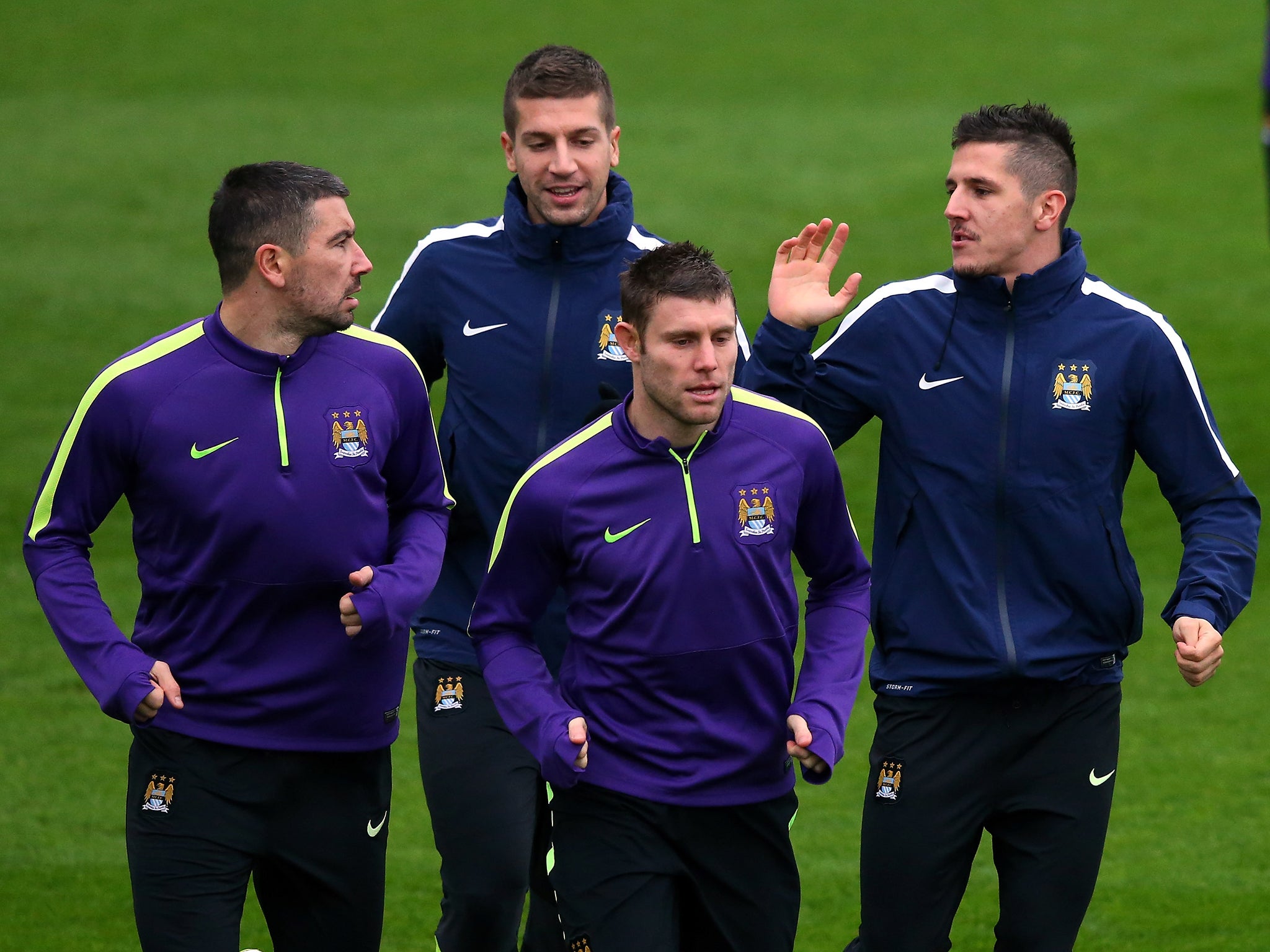 Aleksandar Kolarov, Stevan Jovetic,James Milner and Matija Nastasic of Manchester City warm up prior to their game with Roma