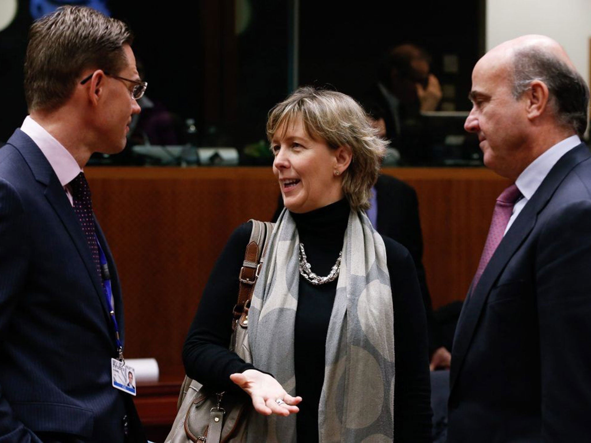 European Commissioner for Jobs, Growth, Investment and Competitiveness Jyrki Katainen (left), Portuguese Finance Minister Maria Luis Albuquerque and Spanish Finance Minister Luis de Guindos talk before the start of the Ecofin meeting at the European Counc