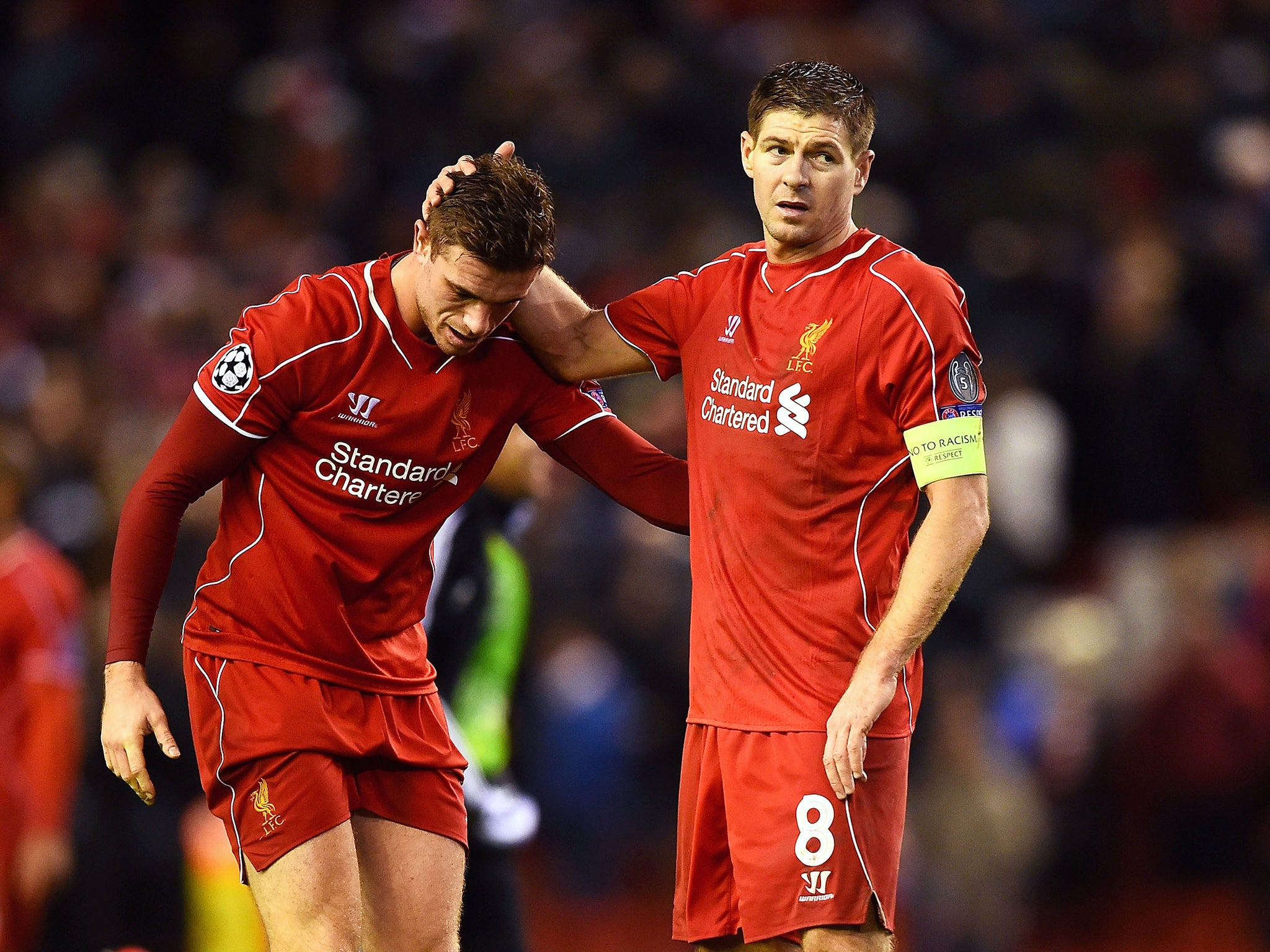 Dejected Liverpool players Jordan Henderson and Steven Gerrard