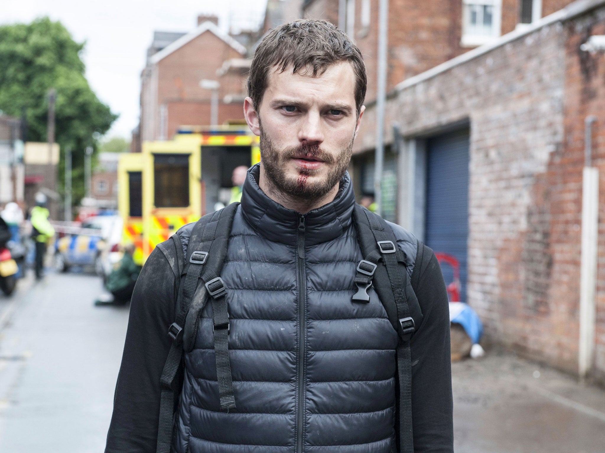 Paul Spector walks away from a crime scene