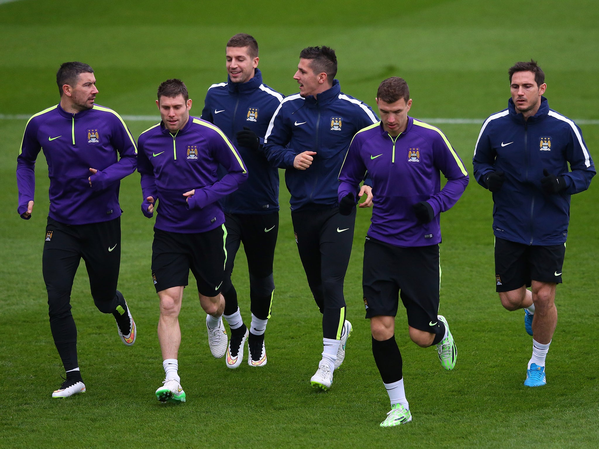 Aleksandar Kolarov, Stevan Jovetic,James Milner, Edin Dzeko, Matija Nastasic and Frank Lampard of Manchester City warm up