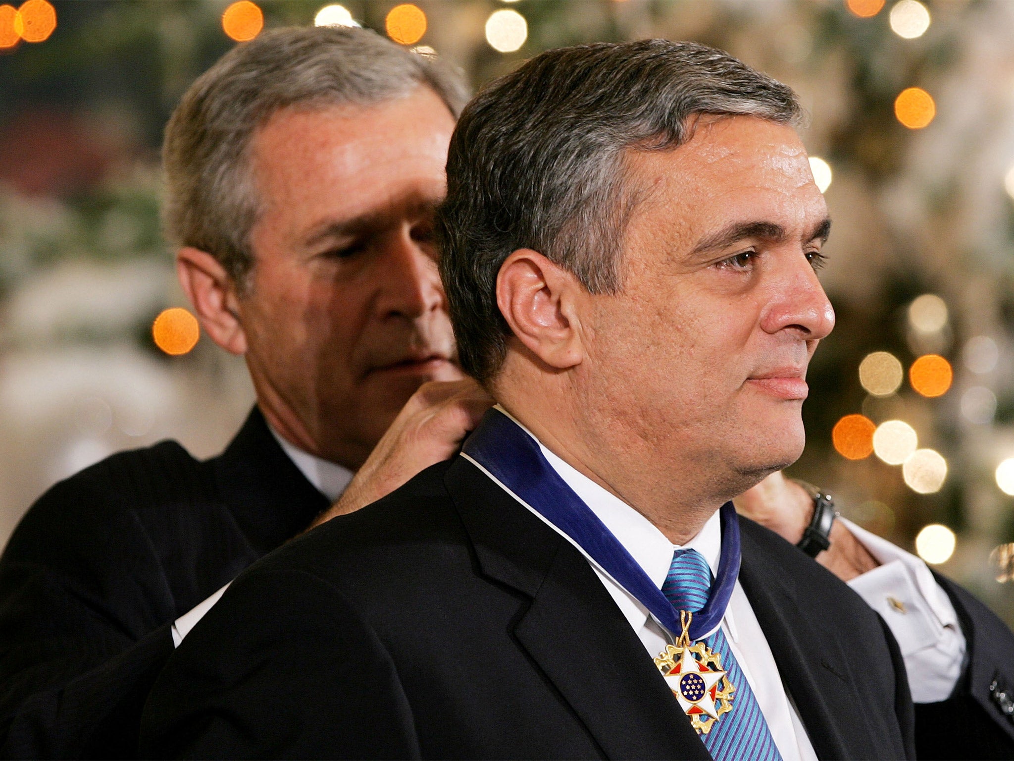 President George W Bush awards former Director of the CIA, George Tenet, with the Presidential Medal of Freedom in 2004 (Getty)