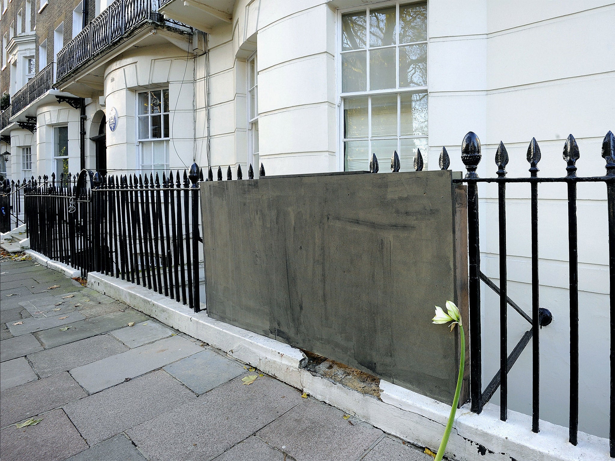 Flowers are left at the scene in Montagu Square, Marylebone, London