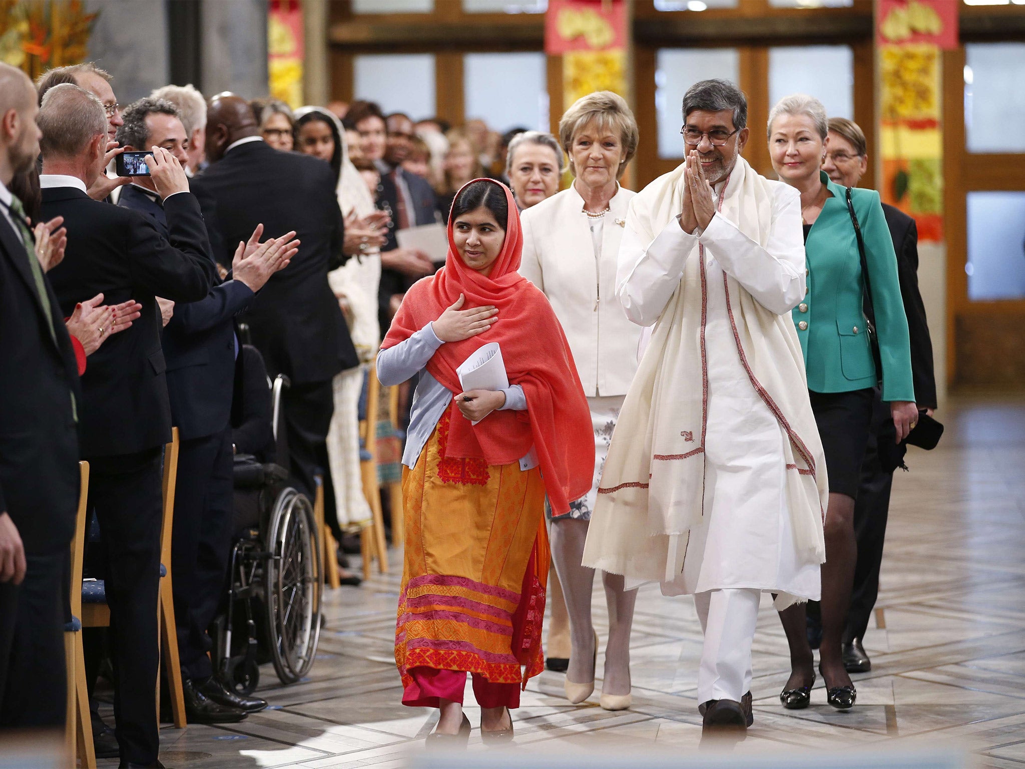 Malala Yousafzai and Kailash Satyarthi at Oslo City Hall to receive the Nobel Peace Prize