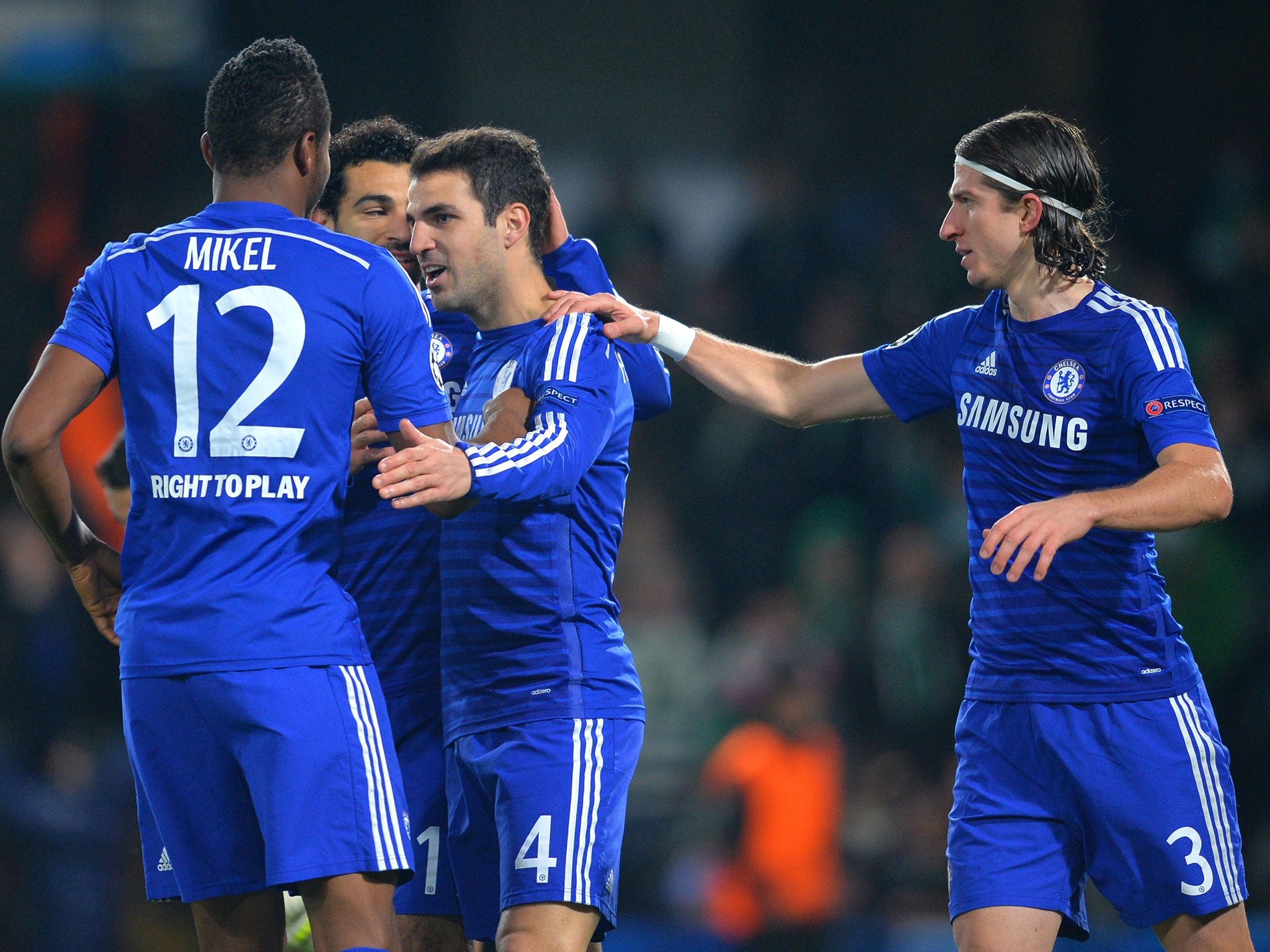 Cesc Fabregas is mobbed after putting Chelsea 1-0 up