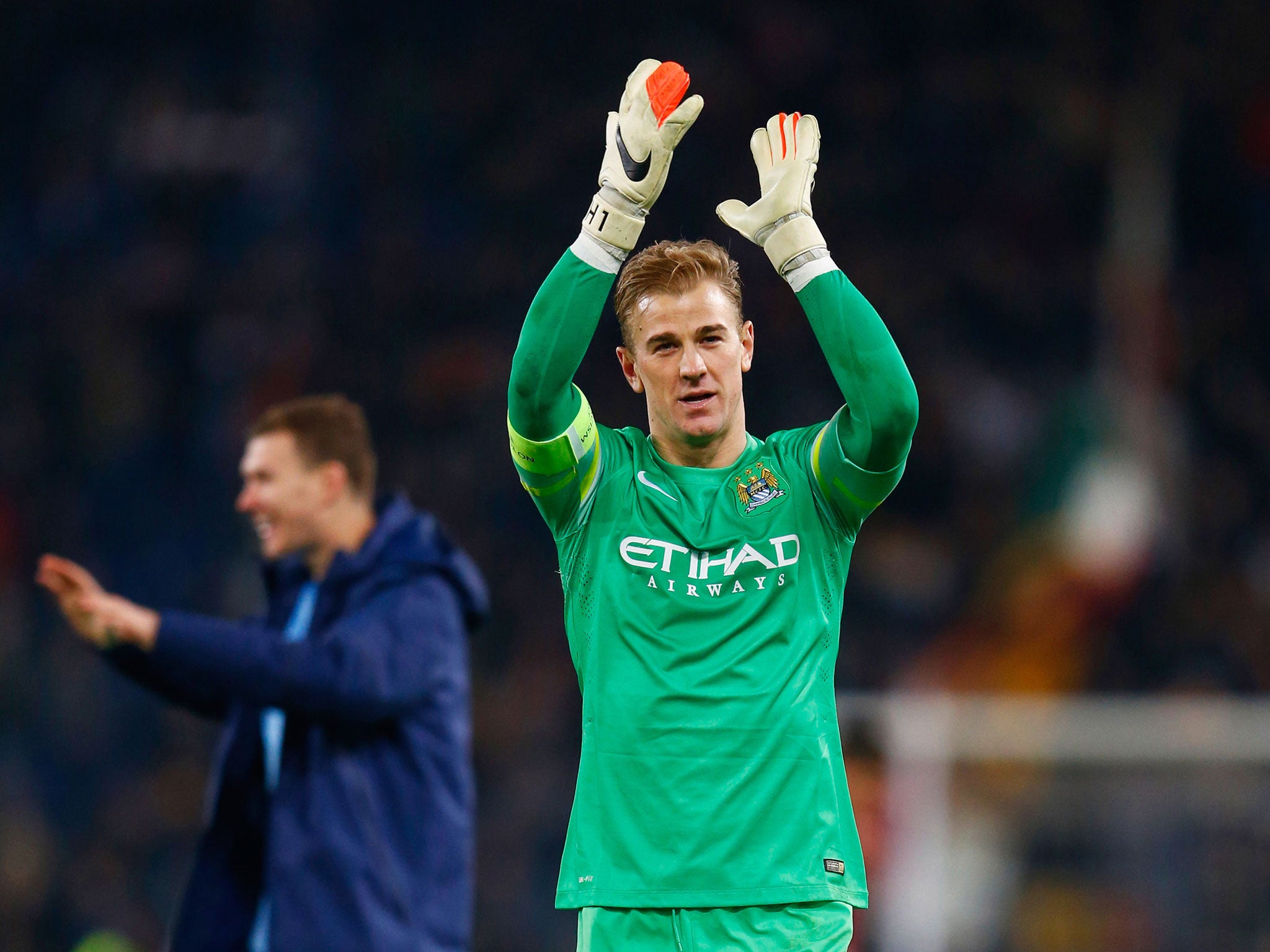 Joe Hart applauds the City faithful