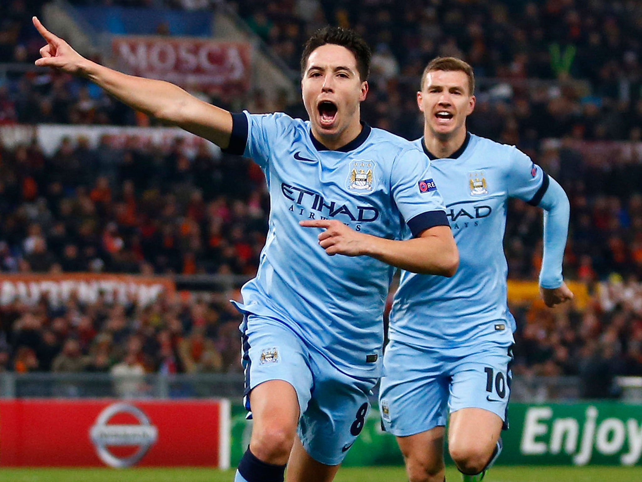 Samir Nasri celebrates his goal with Edin Dzeko