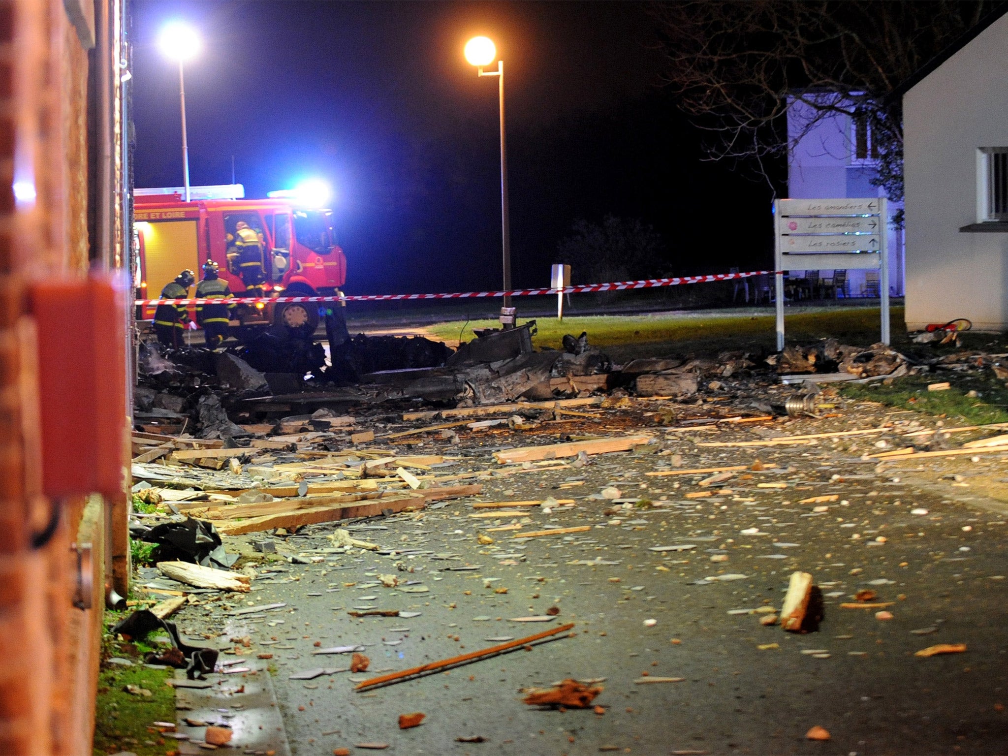 Debris from the Alphajet plane is littered across the crash scene (Getty)