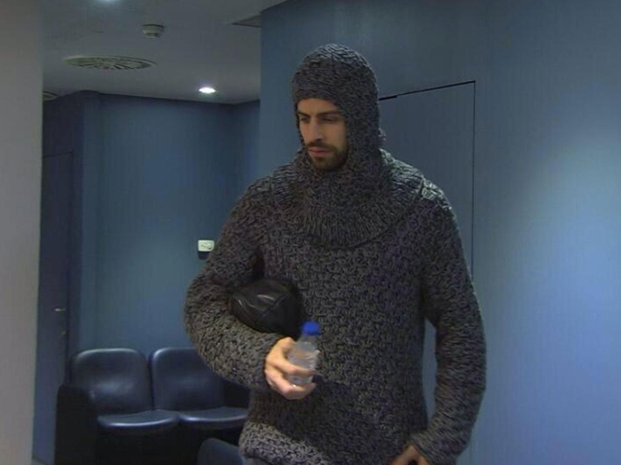 Gerard Pique enters the Nou Camp in his bizarre jumper last night