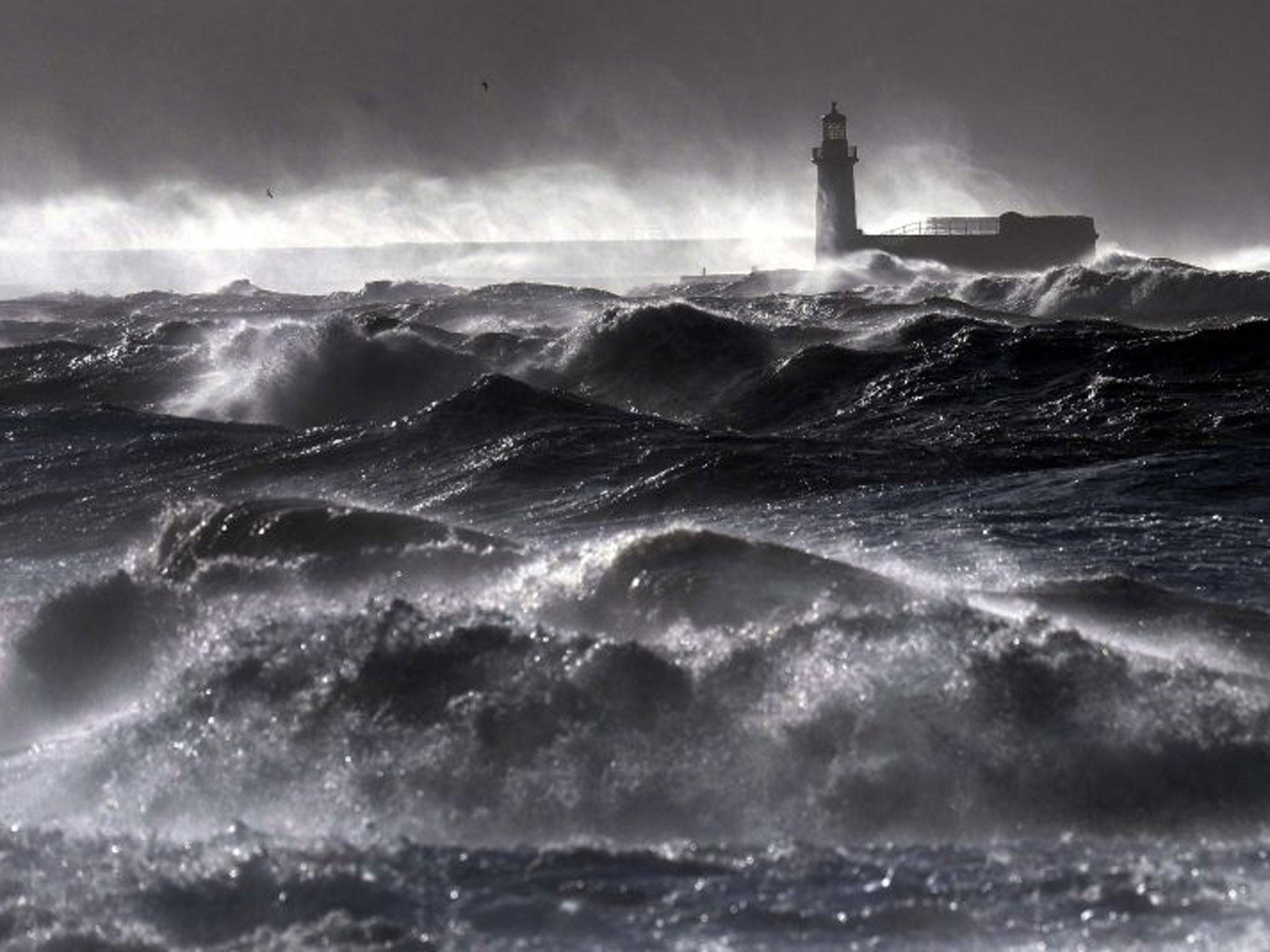 Giant waves hit the lighthouse wall at Whitehaven, as the stormy weather is causing disruption across parts of the UK with power cuts, ferry and train cancellations and difficult driving conditions. PRESS ASSOCIATION Photo. Picture date: Wednesday Decembe