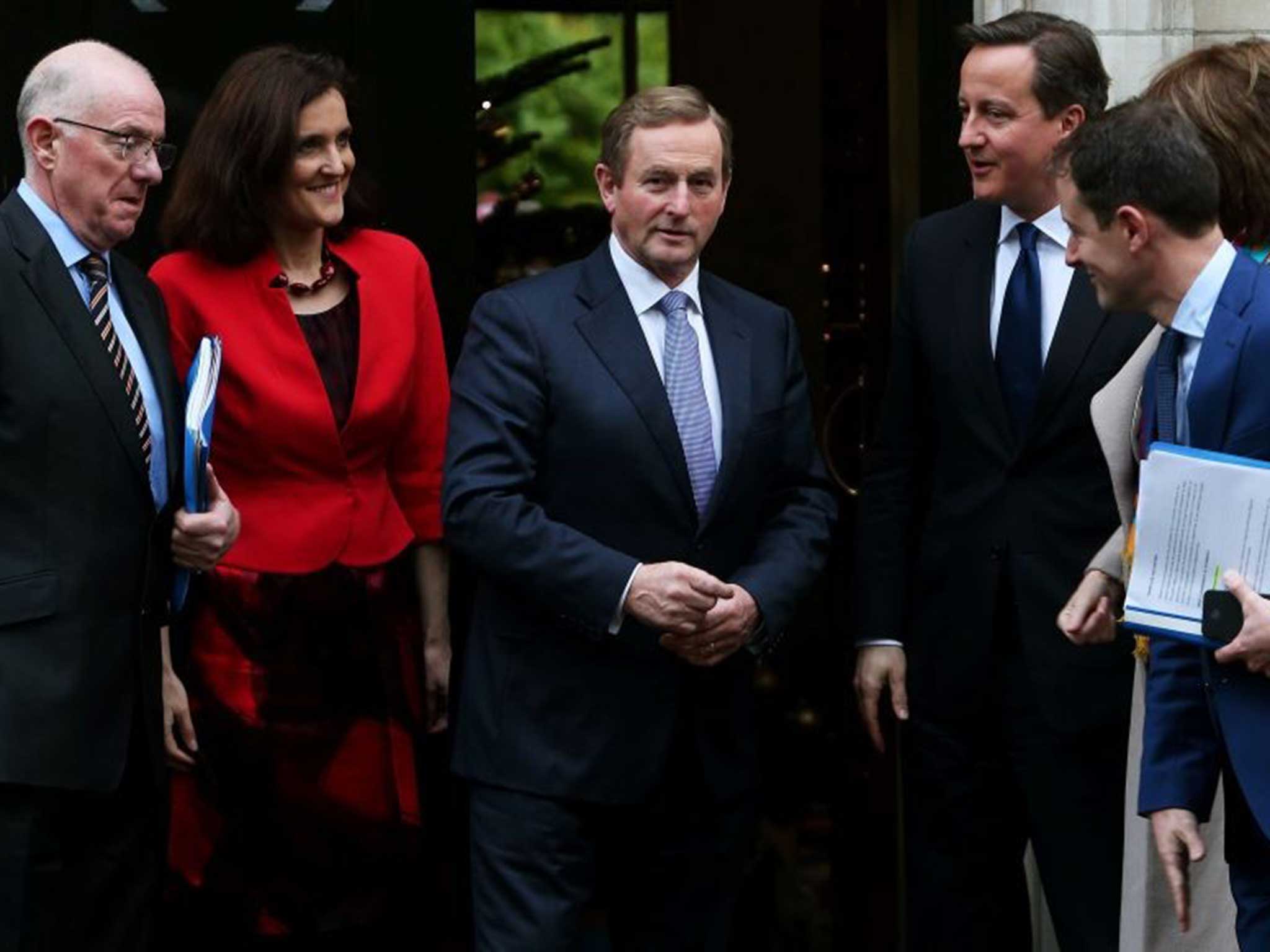 Prime Minister David Cameron and An Taoiseach Enda Kenny (centre) with (from left) Minister for Foreign Affairs Charlie Flanagan, Secretary of State Theresa Villiers, Sean Sherlock Minister of State at Department of Foreign Affairs, and Tanaiste Joan Burt