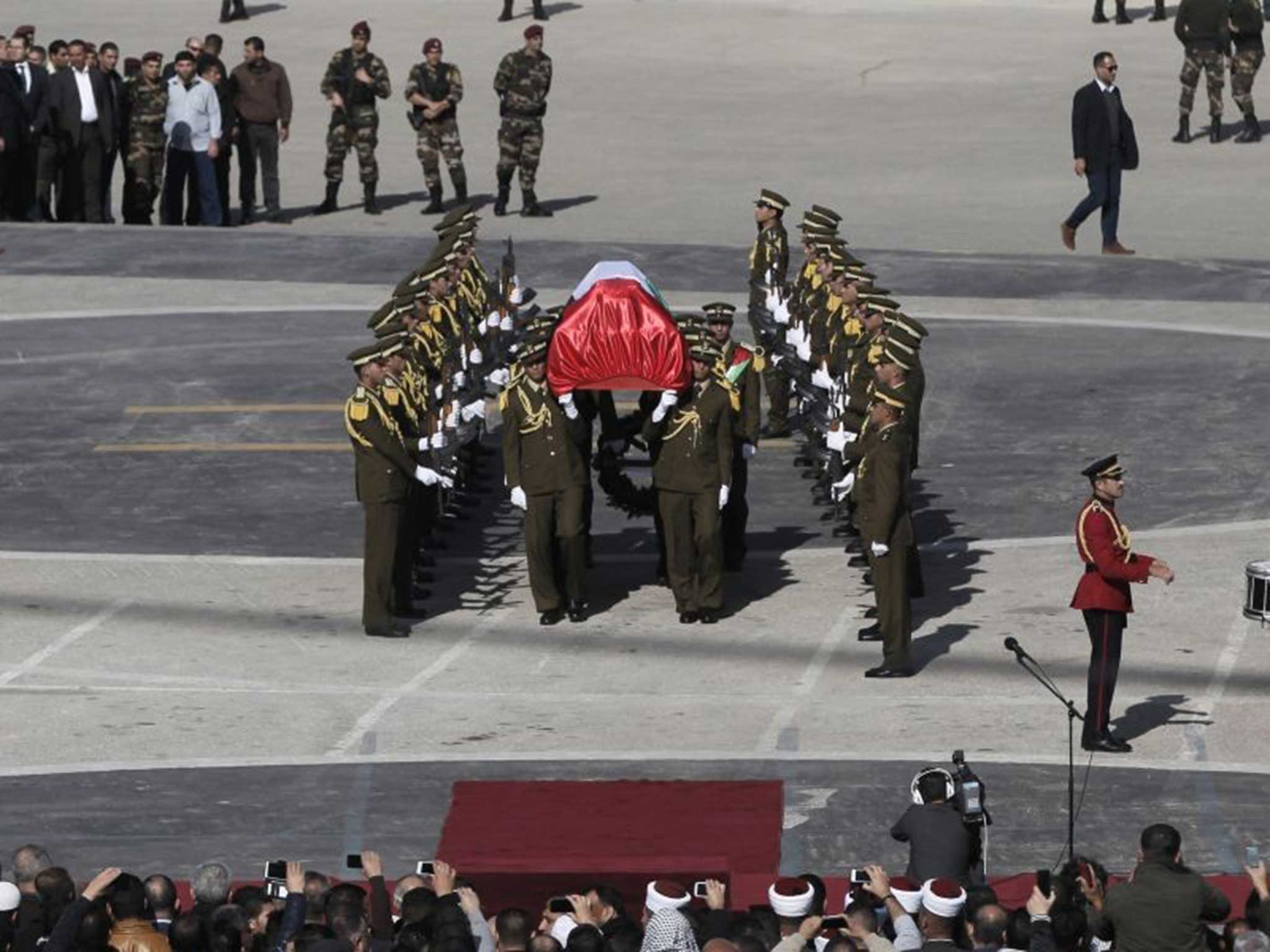 Palestinian security members carry the coffin of senior Palestinian official Ziad Abu Ein during his funeral