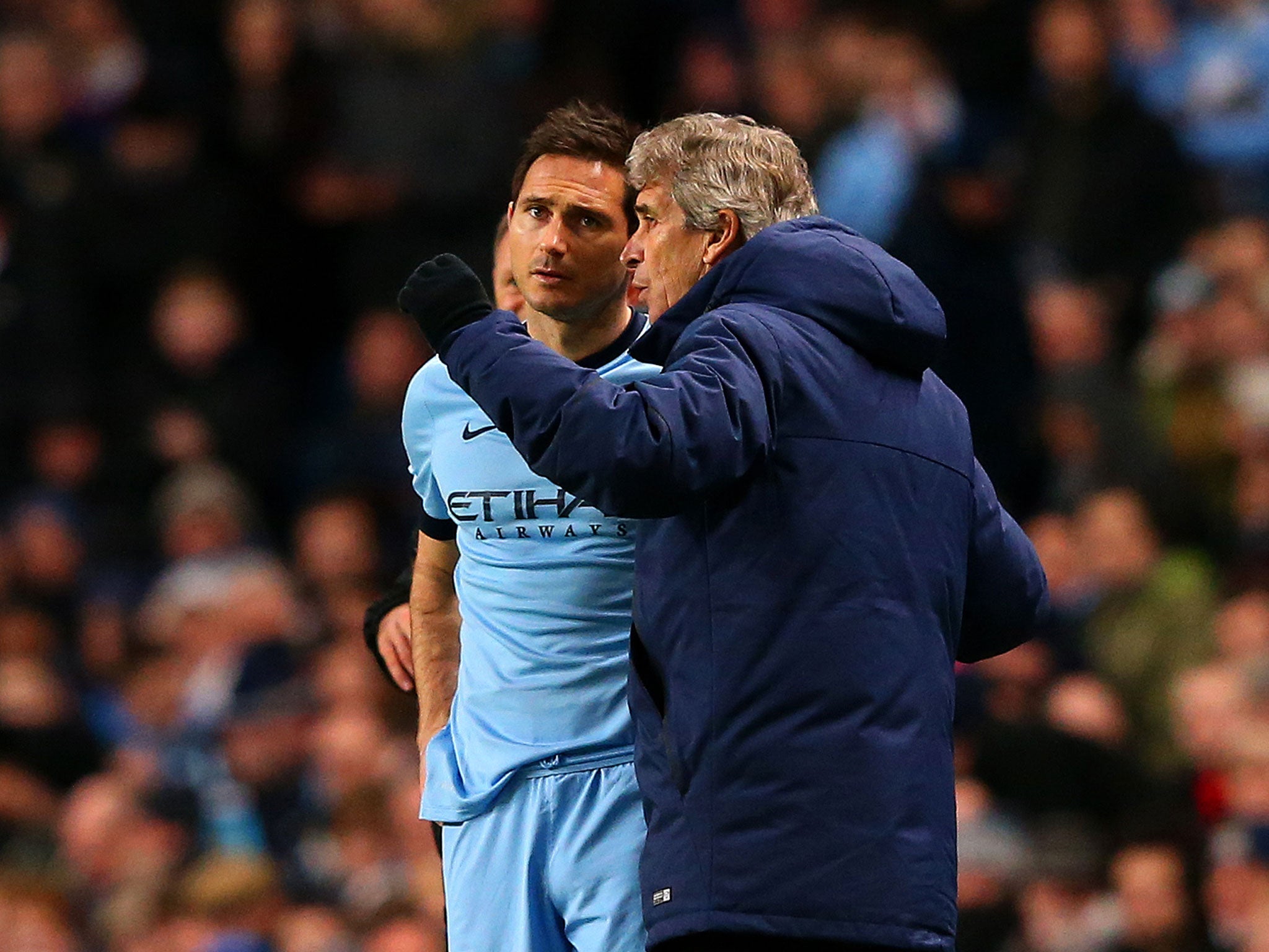 Manuel Pellegrini gives Frank Lampard instructions before bringing him on