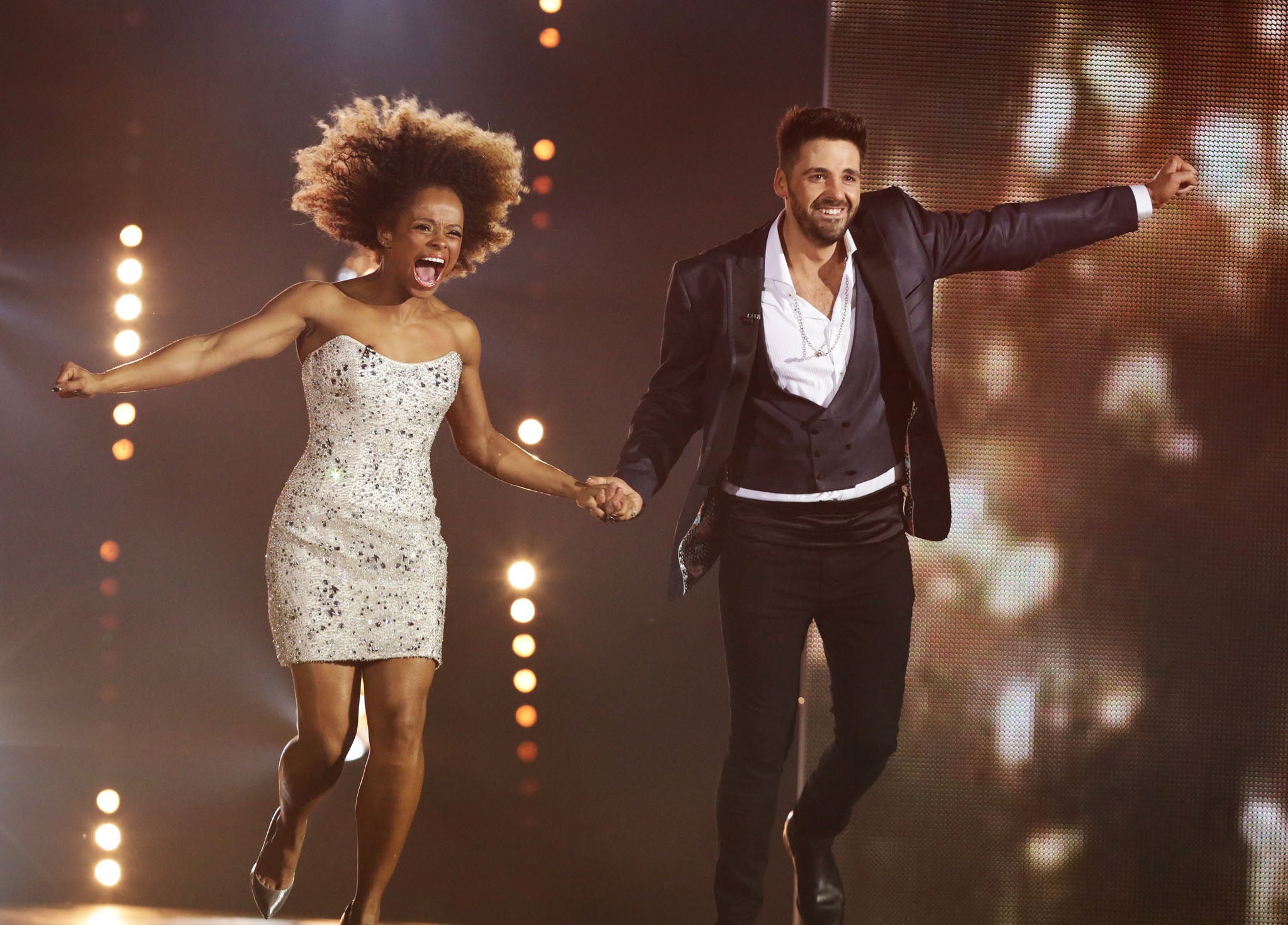 Fleur East and Ben Haenow jump for joy after hearing they have made it through to the live final