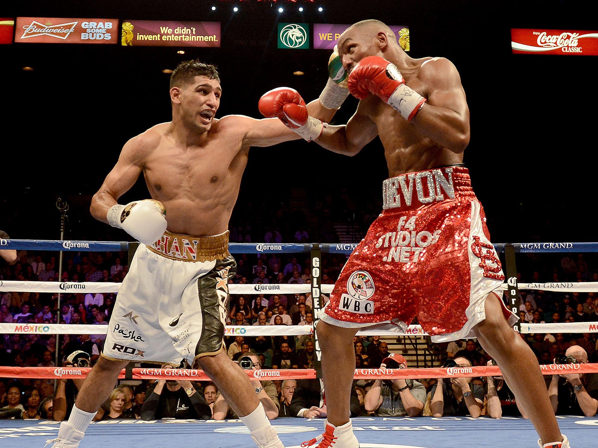 Khan lands a blow on Alexander en route to his points win