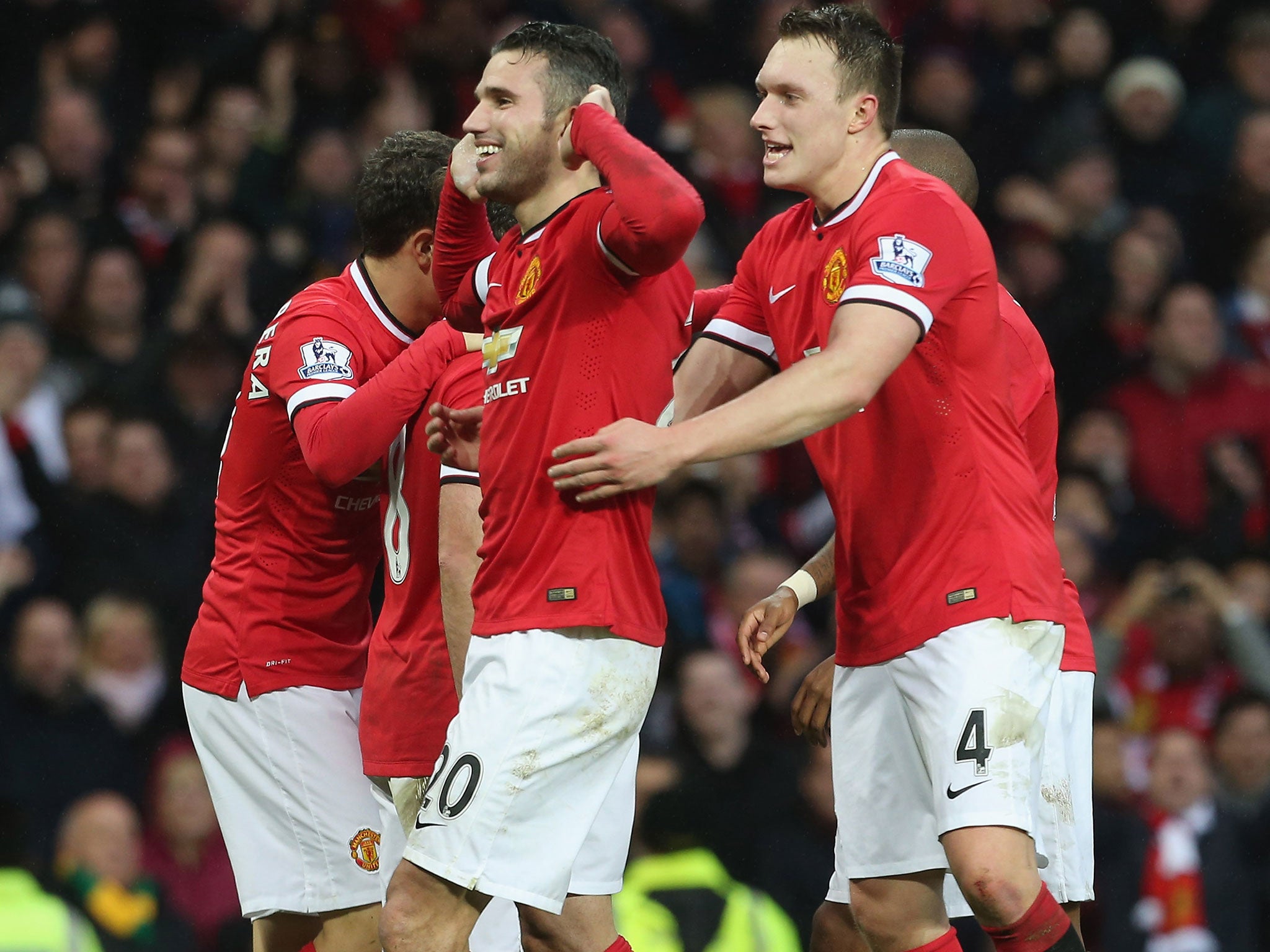 Robin van Persie celebrates scoring United's third