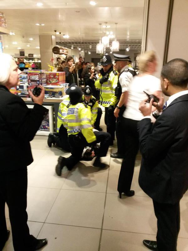 A man was held down by police in John Lewis during a protest, but it is not sure if he was one of the demonstrators