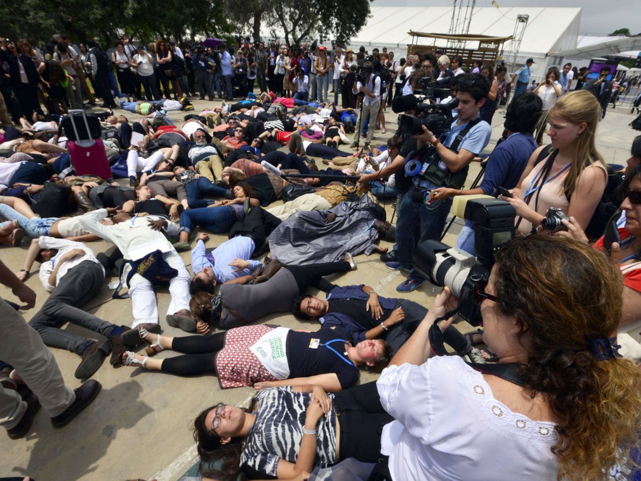 Activists demonstrate outside the climate change conference in Lima earlier this week. Some corners have denounced the talks as weak and ineffectual