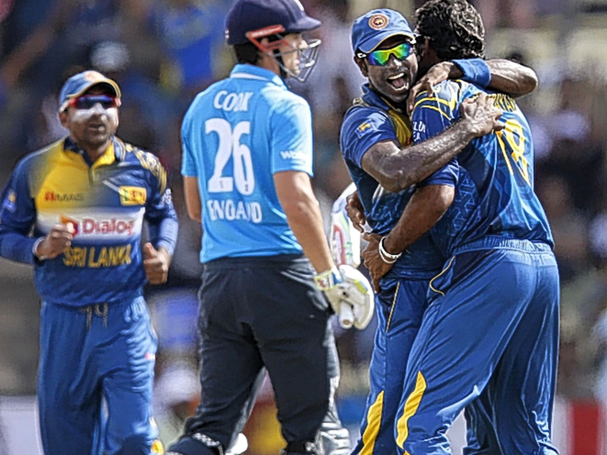 Alastair Cook walks after falling lbw for 1 to Sachithra Senanayake (right, with Sri Lanka captain Angelo Mathews)