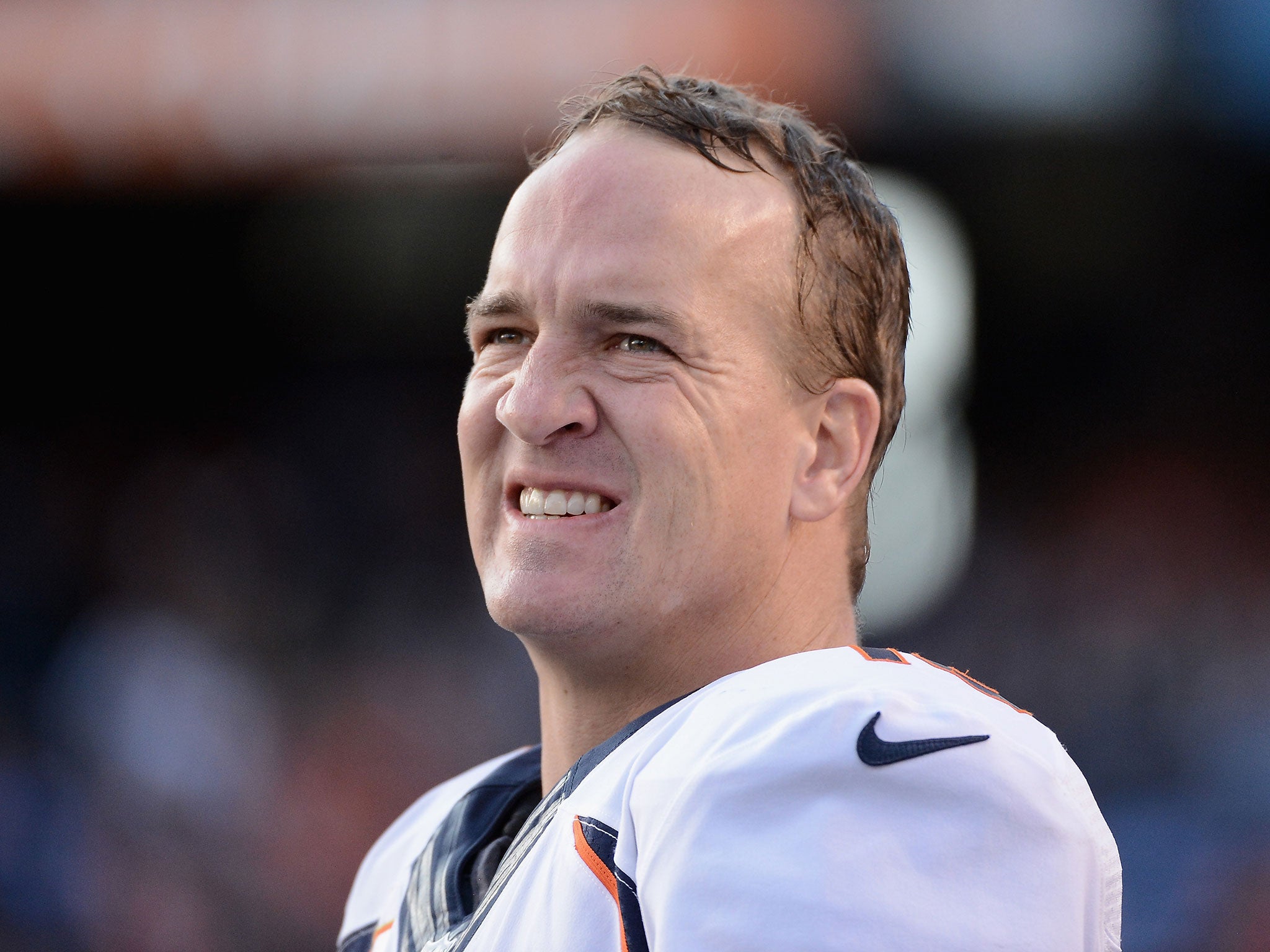 Manning overcame a thigh injury and illness to clinch the AFC West title