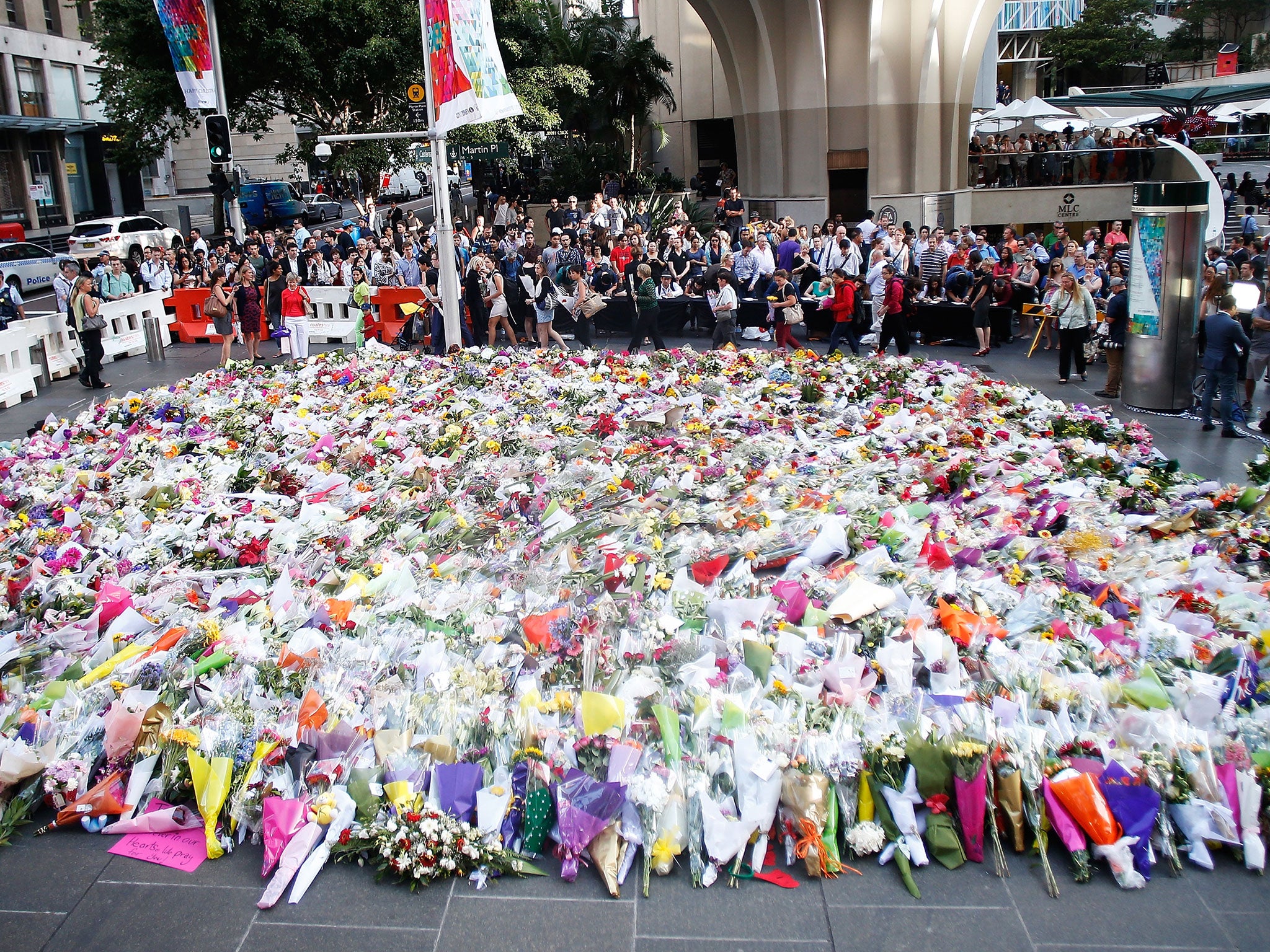 A Muslim bride interrupted her wedding day to lay her bouquet at the memorial site in Sydney