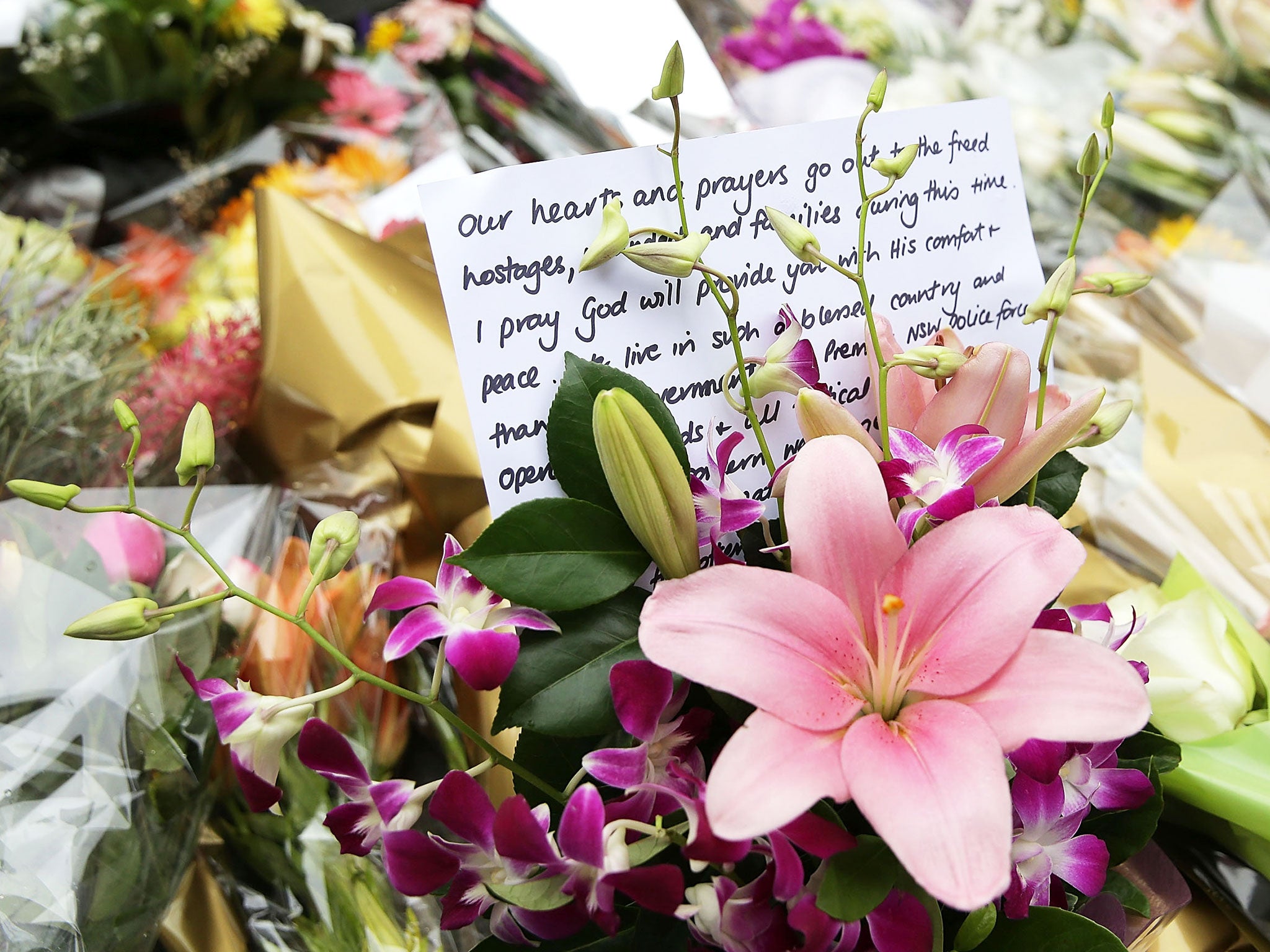 Flowers are left as a sign of respect at Martin Place in Sydney