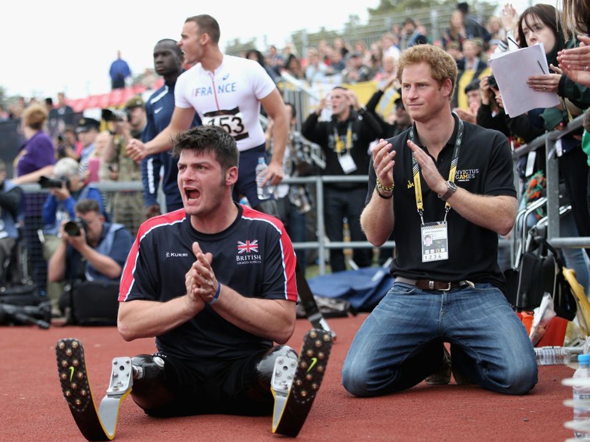 Dave Henson pictured with Prince Harry cheering on the British team at the 2014 Invictus Games