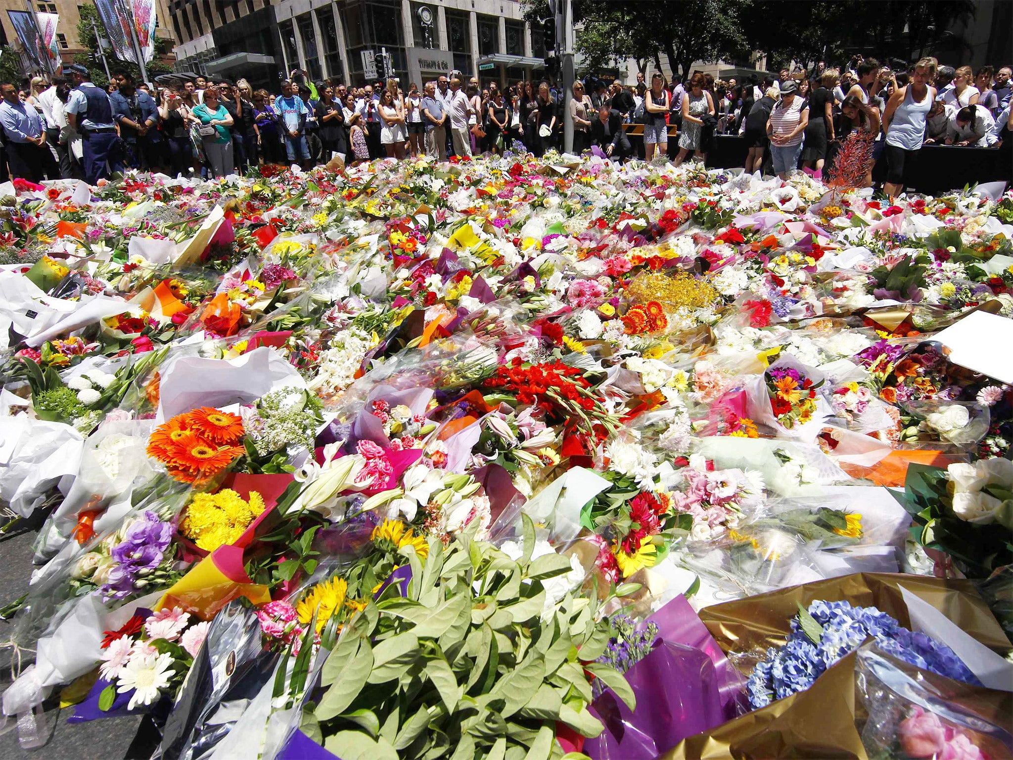 Floral tributes were placed near the café in central Sydney