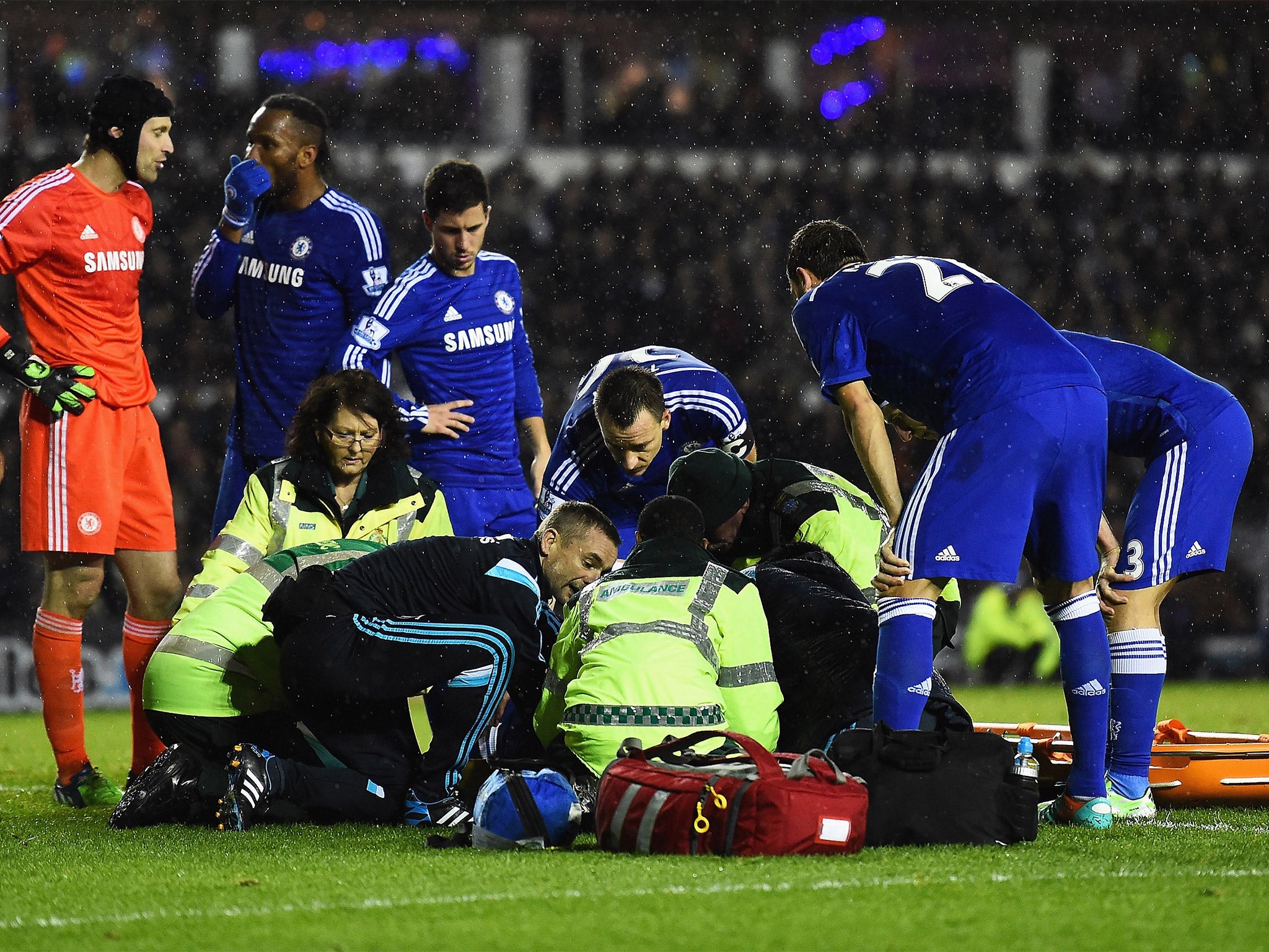 Medical staff treat Kurt Zouma following his collision with teammate Petr Cech