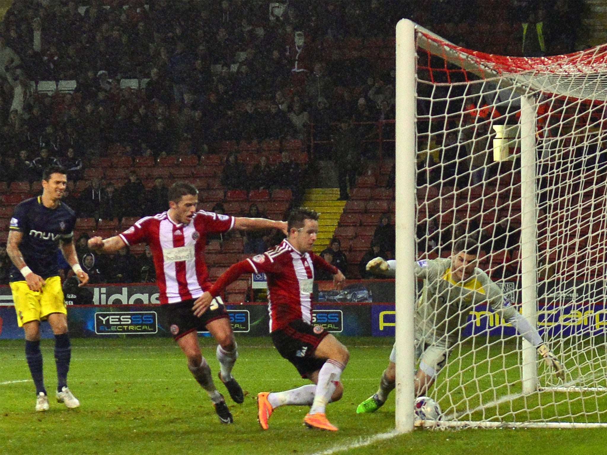 Marc McNulty bundles the ball into the net (Getty)