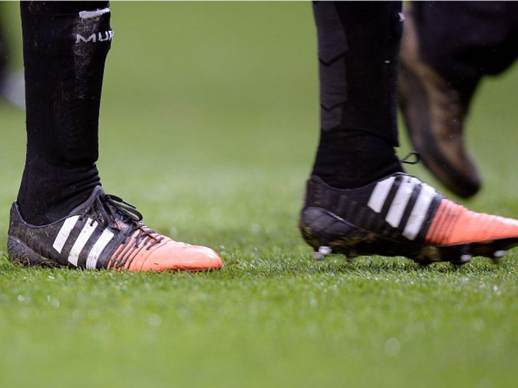 Phil Jones' black boots were splashed with orange on the toe